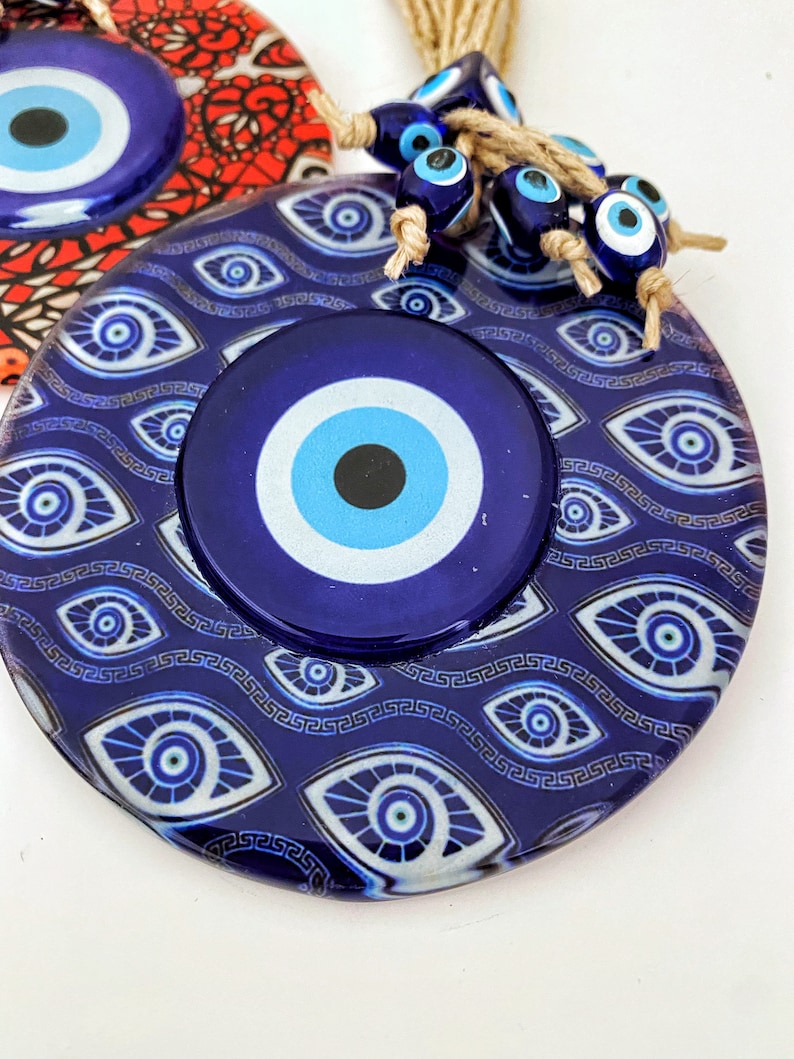 Handmade Evil Eye Wall Hanging featuring mosaic glass and evil eye beads, perfect for home decoration and protection.