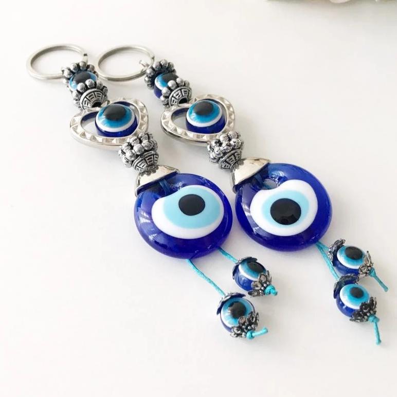 Evileye heart charm keychain featuring a heart and evil eye design, perfect for keys or bags.