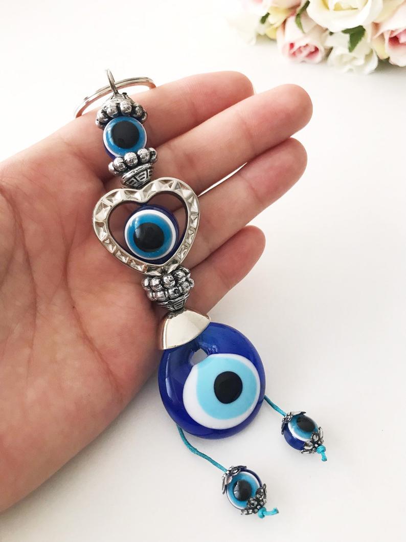 Evileye heart charm keychain featuring a heart and evil eye design, perfect for keys or bags.