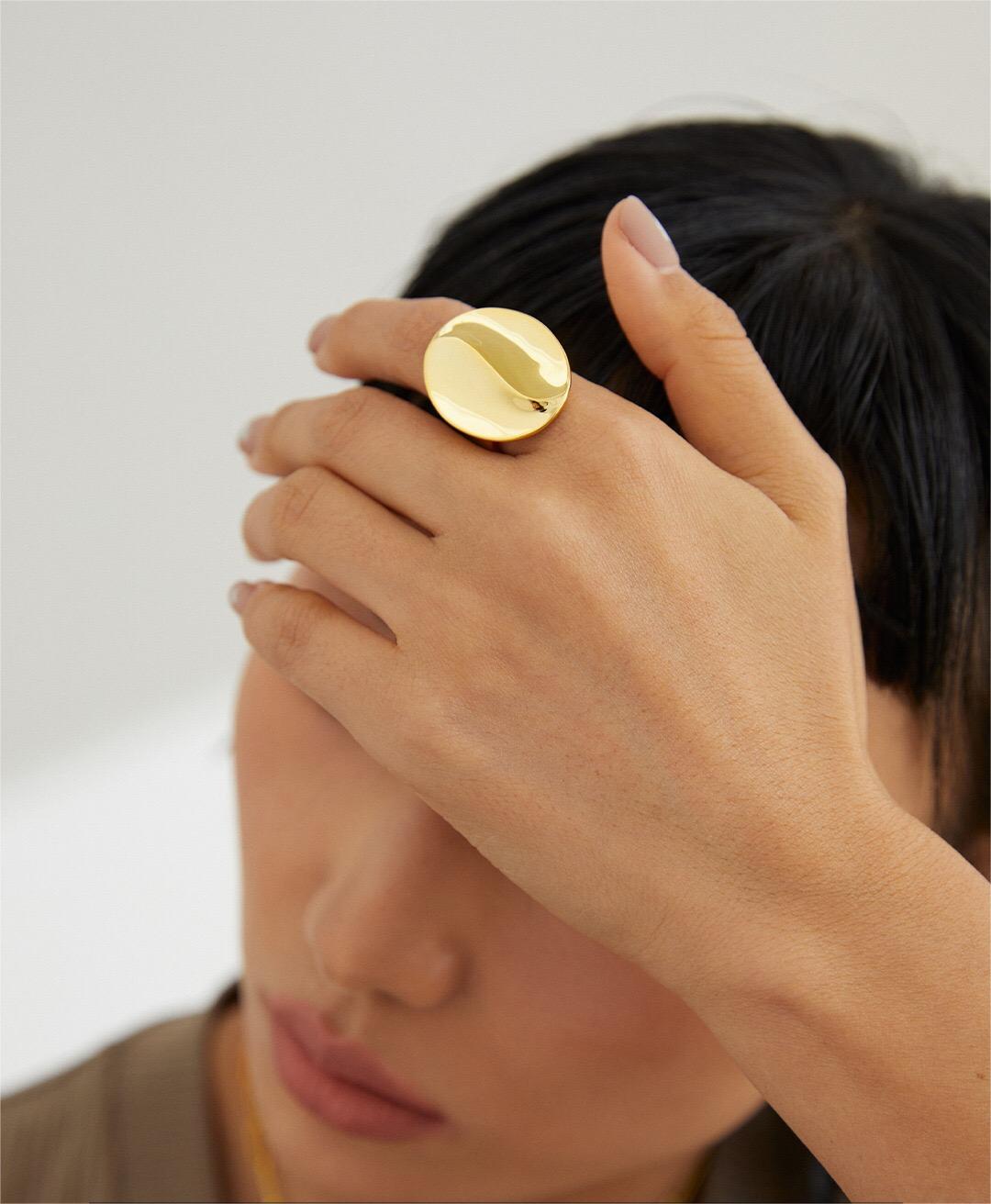 Exaggerated Geometric Shape Metal Ring made of sterling silver with gold vermeil finish, showcasing its unique design and adjustable size.