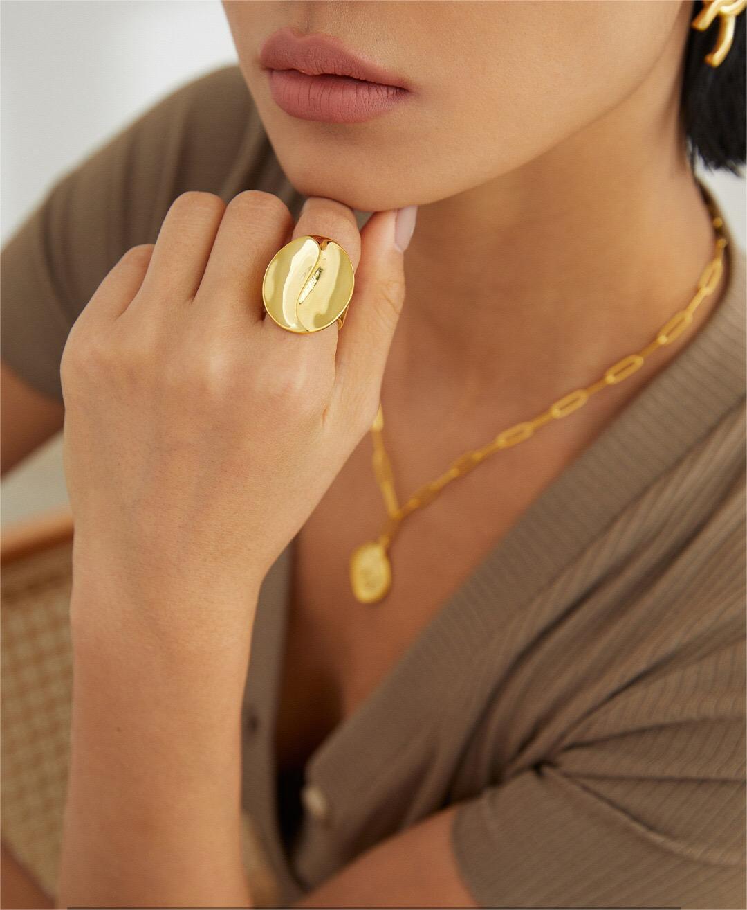 Exaggerated Geometric Shape Metal Ring made of sterling silver with gold vermeil finish, showcasing its unique design and adjustable size.