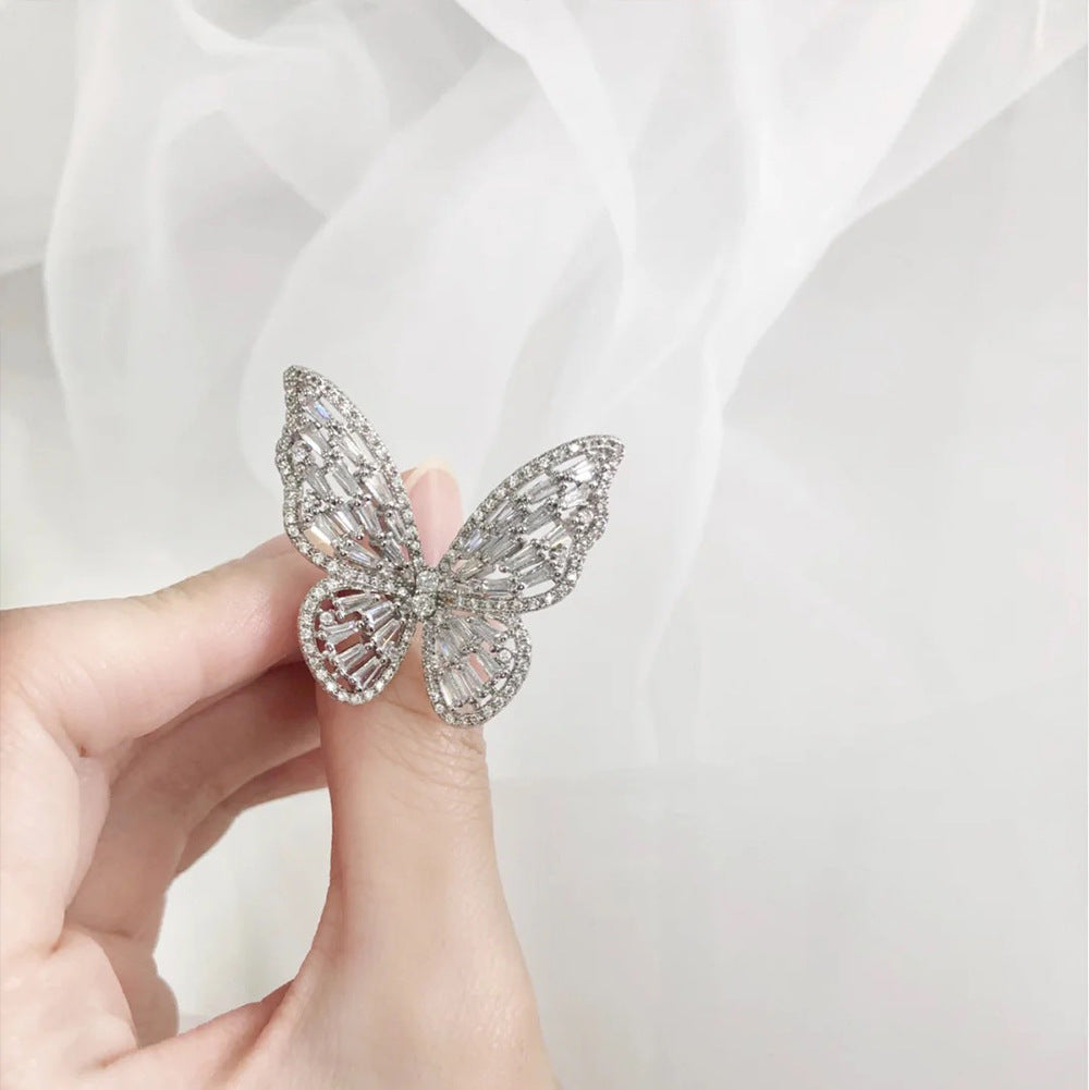 A beautifully crafted butterfly ring made of 925 sterling silver with a white gold finish, showcasing exquisite workmanship.