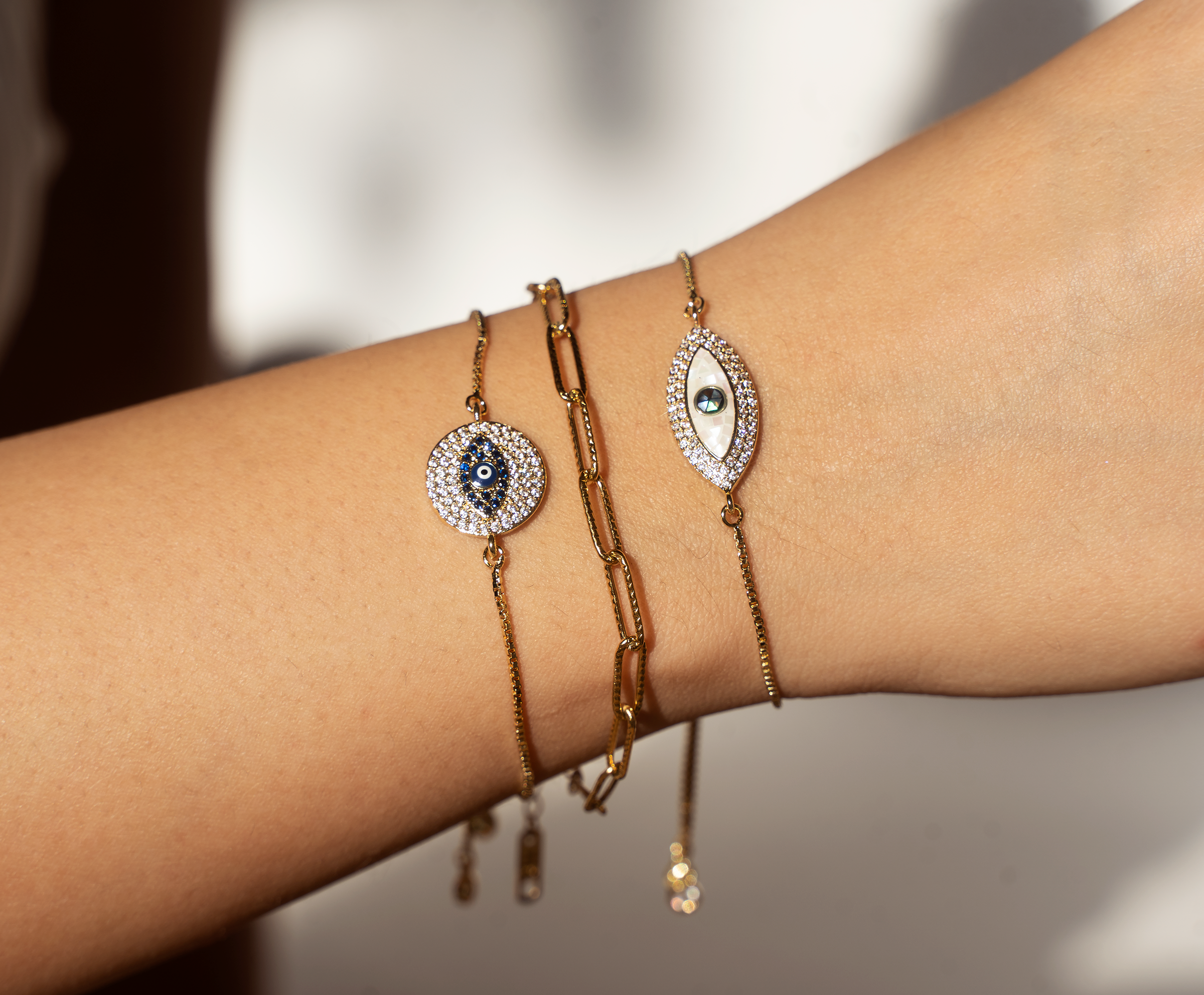 EZRA Bracelet featuring an evil eye design with sparkling cubic zirconia stones and a gold-plated brass finish.