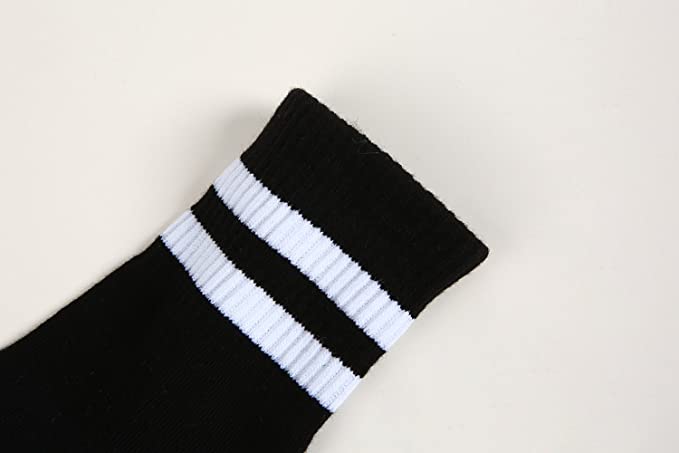 A pair of black knitted socks with white letters spelling 'F** Off', showcasing a humorous and casual design.