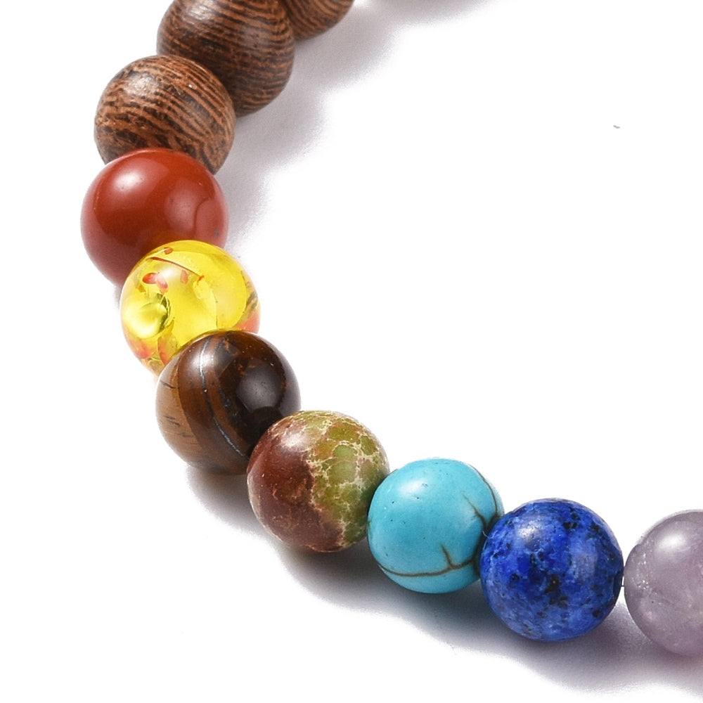 Family Tree Chakra Beaded Stretch Bracelet featuring colorful chakra beads on a brown kraft packaging tag.