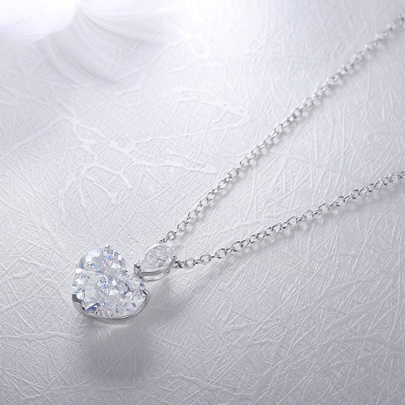 Elegant fancy heart necklace made of 925 sterling silver and real white gold, showcasing a beautiful heart design.