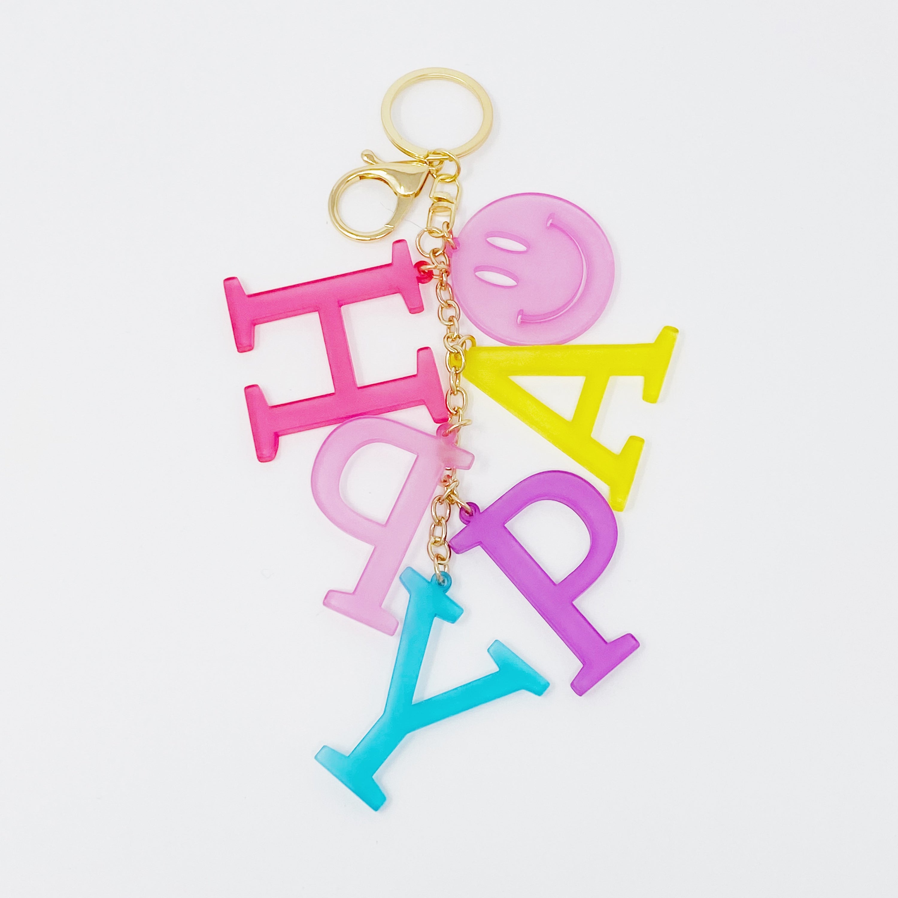 A stylish Favorite Word Jingle Key Chain featuring beautifully cut-out letters and gold tone hardware, perfect for keys or as a bag charm.