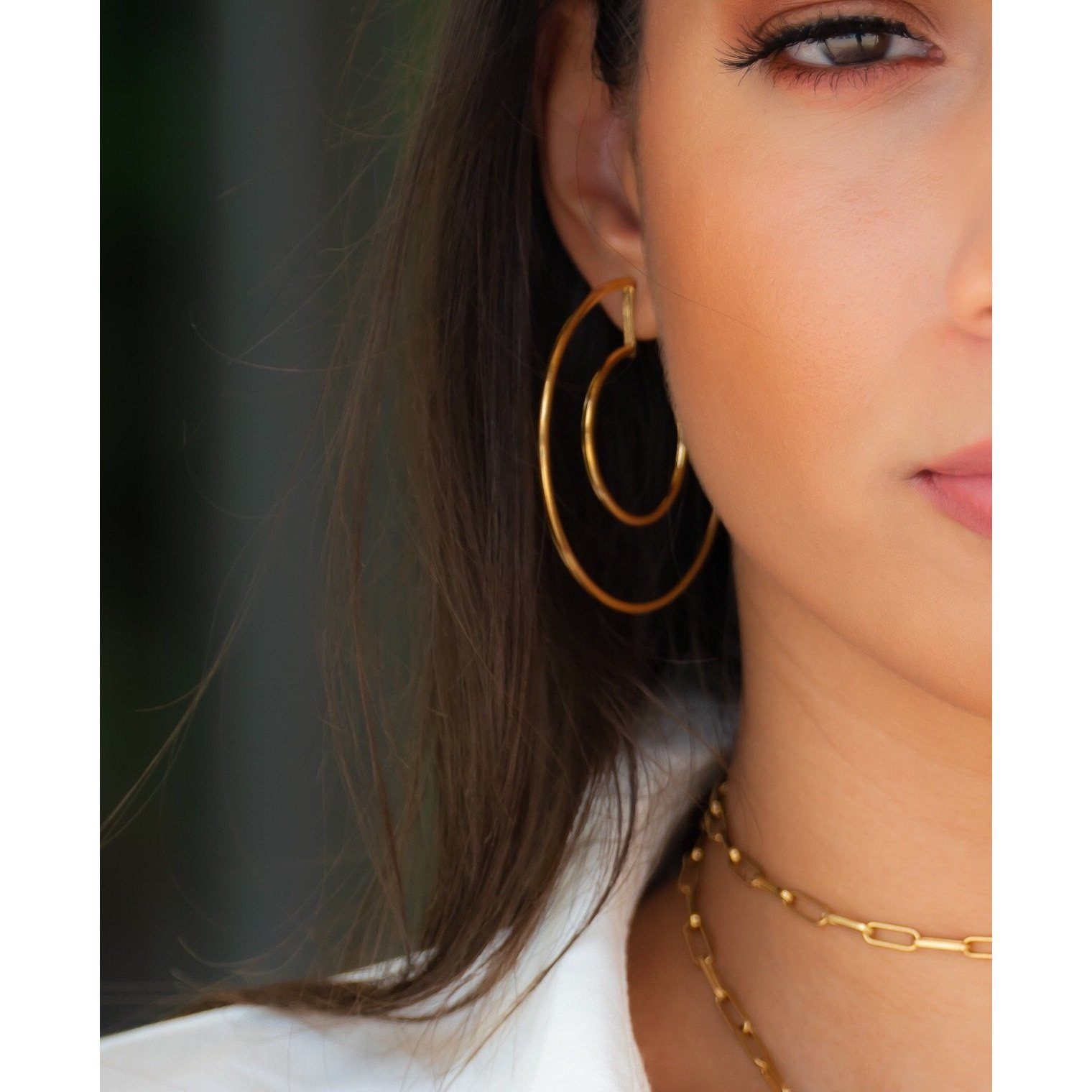 Faye Cutout Hoops in polished 18k gold-plated stainless steel, showcasing a unique cutout design and oversized style.