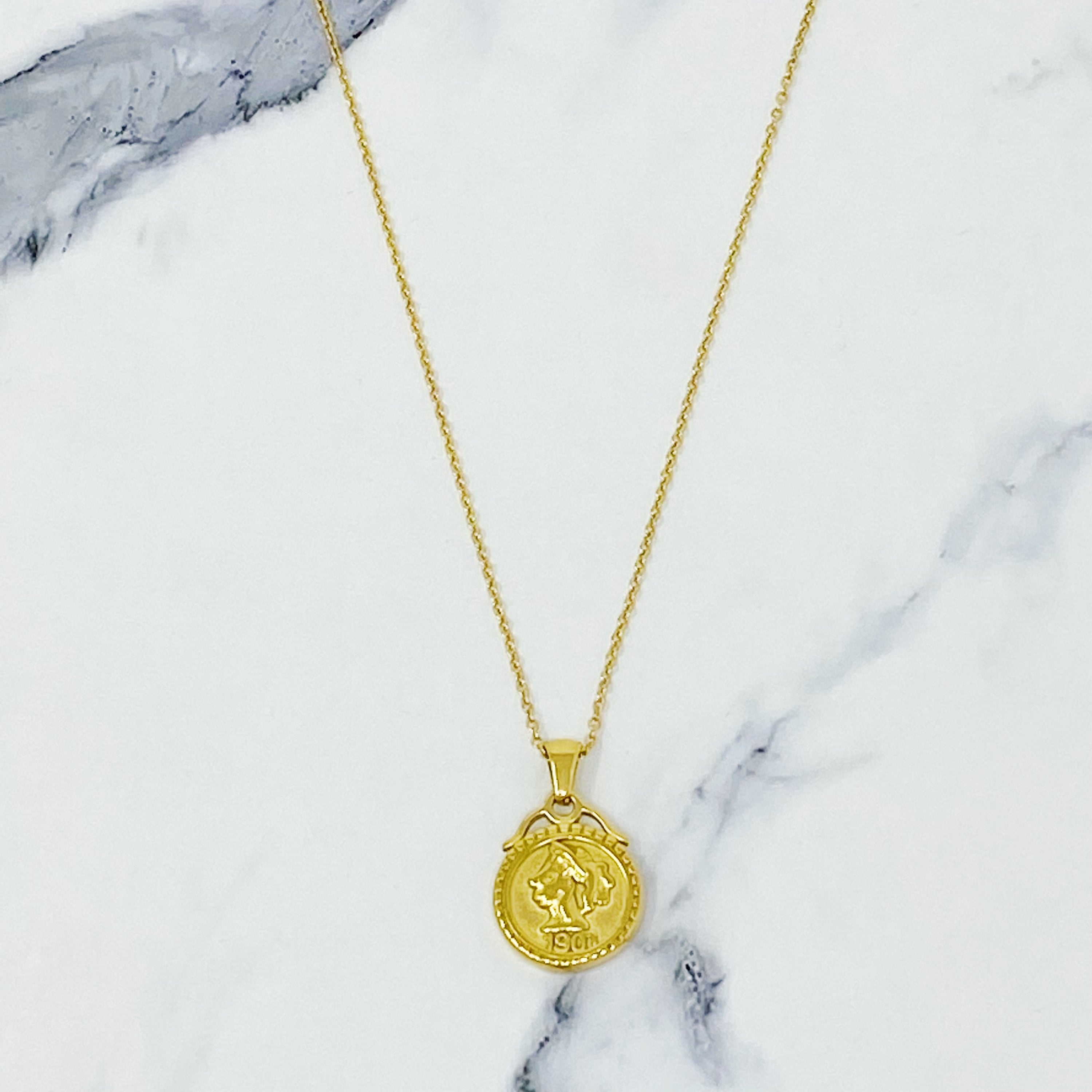 Feminine Coined Necklace featuring a detailed coin pendant with a female silhouette, crafted in 18K gold plated stainless steel.