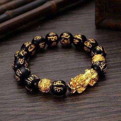 Feng Shui Pi Xiu Black Obsidian Wealth Bracelet with 10mm beads, showcasing its elegant design and deep black color.