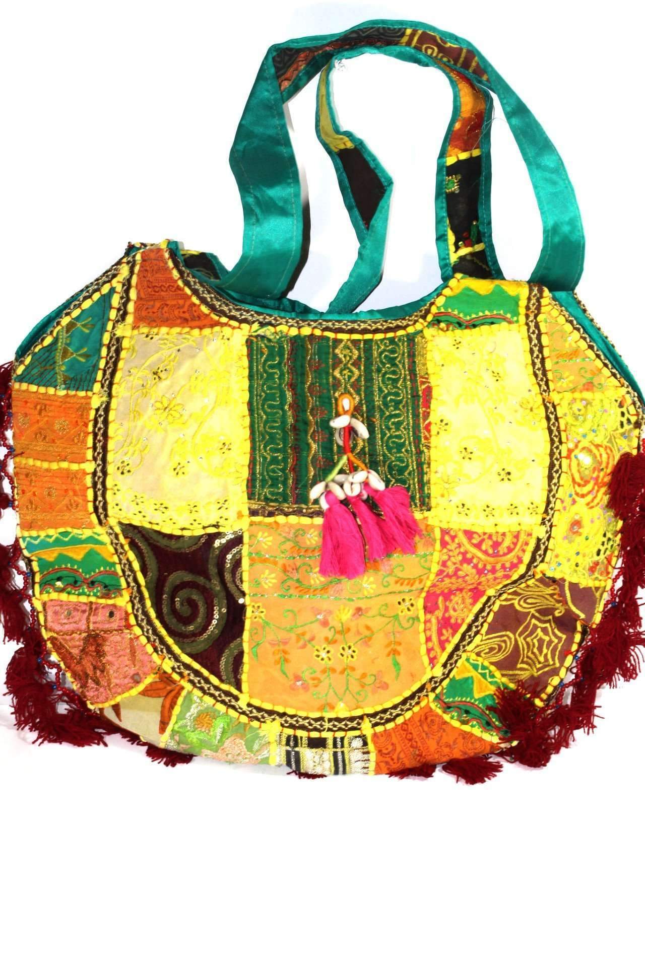 Festival Jhola Carry Bag featuring vibrant patchwork design, mirror work, and tassels, made from 100% cotton.