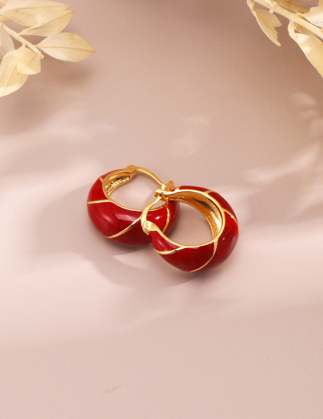 Festive Red Glazed Hoops Earrings featuring a vibrant red glaze and gold vermeil finish, elegantly handcrafted for a unique look.