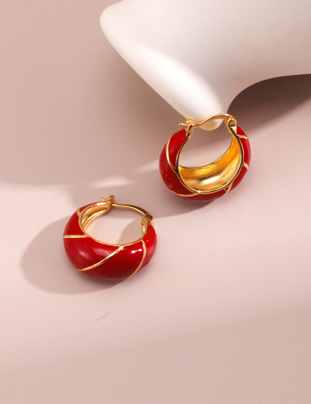 Festive Red Glazed Hoops Earrings featuring a vibrant red glaze and gold vermeil finish, elegantly handcrafted for a unique look.