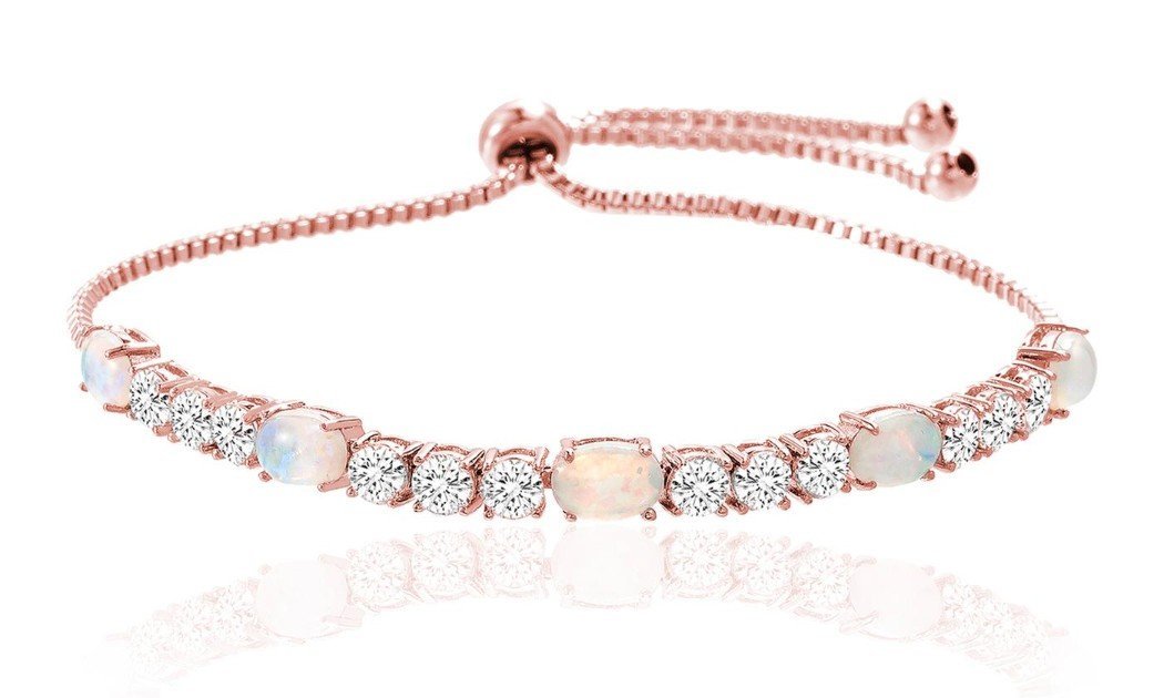 A stunning Fiery Opal Tennis Bracelet featuring genuine opal and sparkling crystals, elegantly plated in 18K white gold.