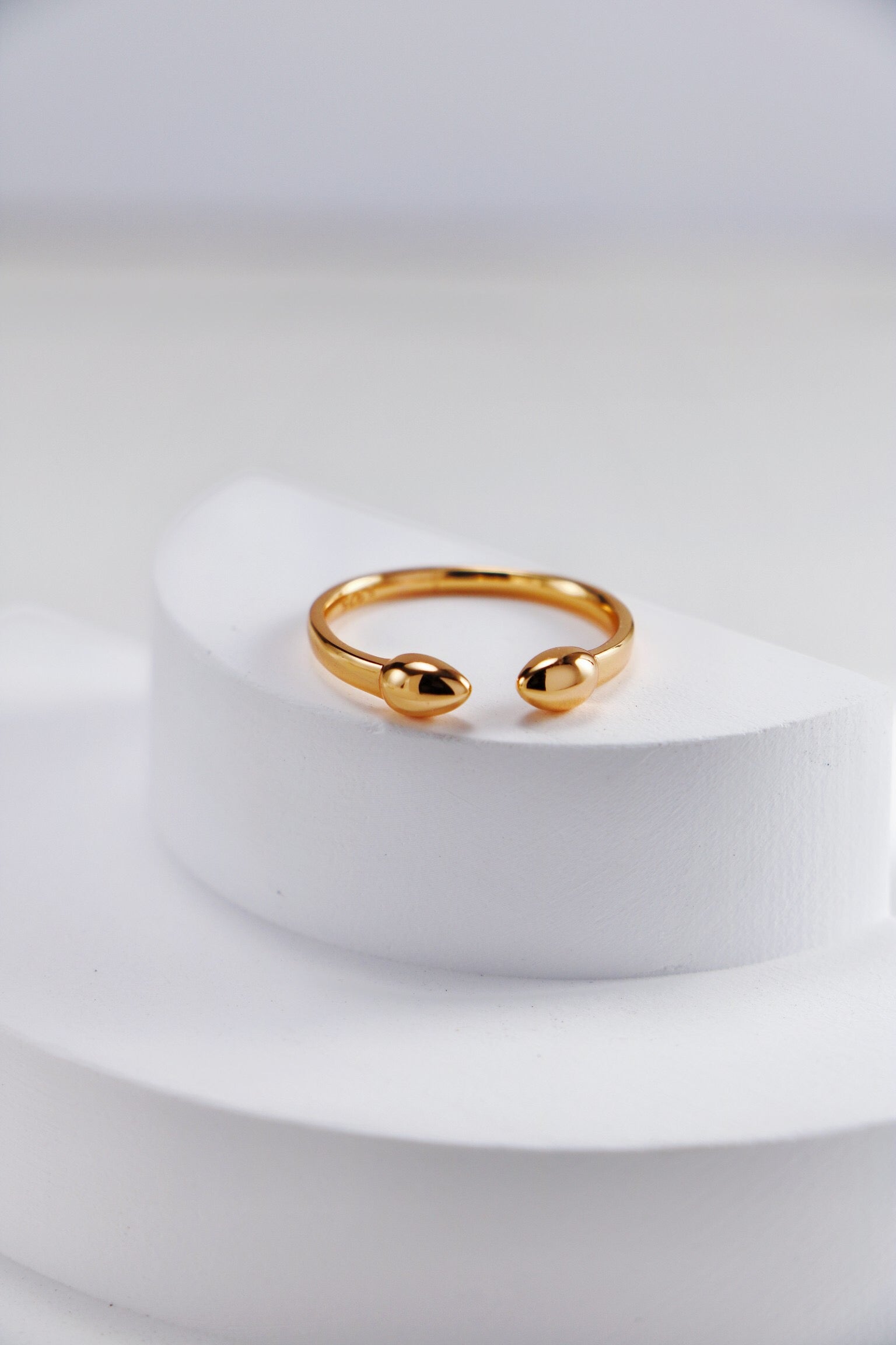 Fiji Bud Stacking Ring made of gold vermeil, showcasing its elegant design and shiny finish.