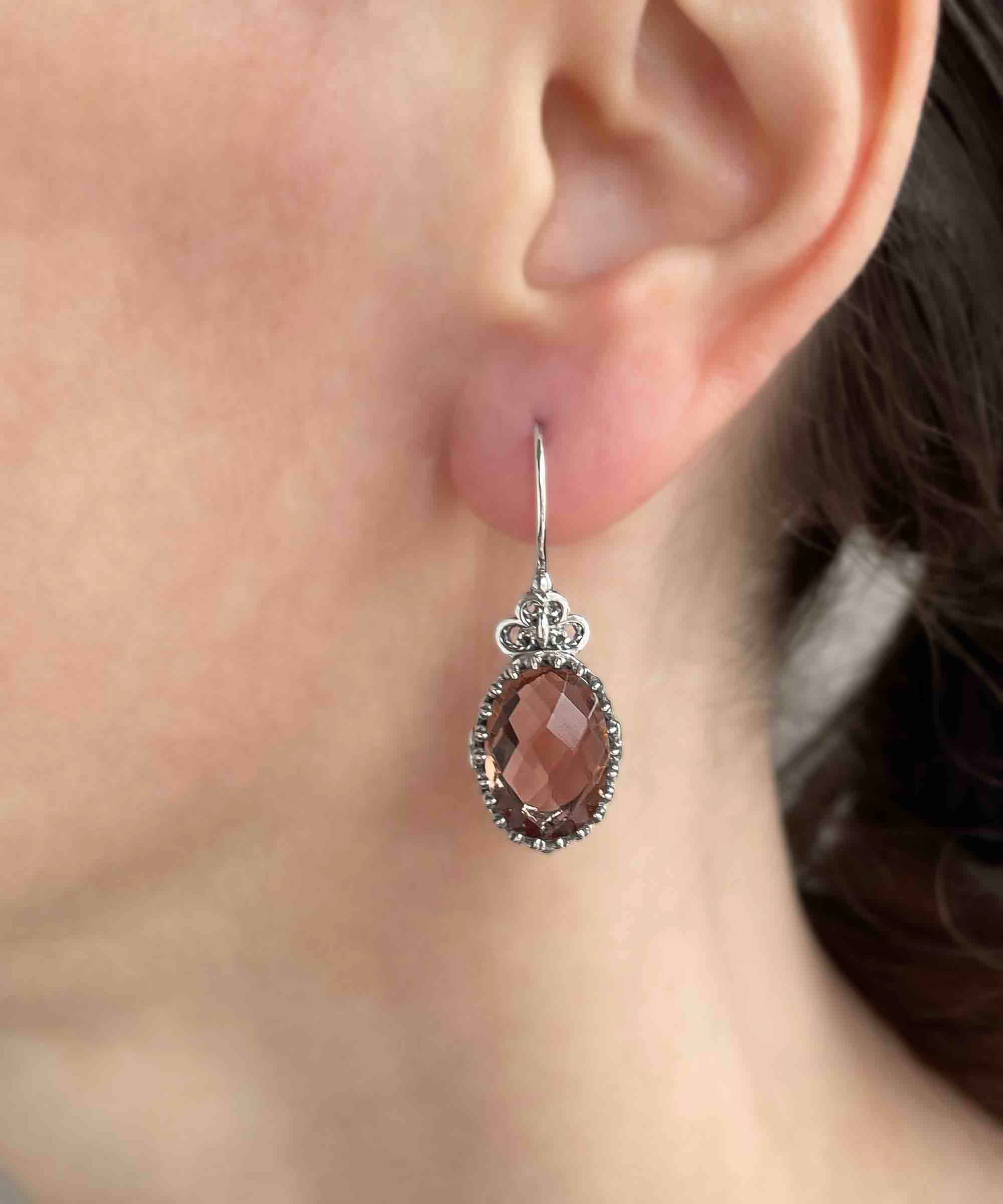 Elegant 925 sterling silver drop earrings featuring intricate filigree heart design and double-sided oval cut alexandrite gemstone.