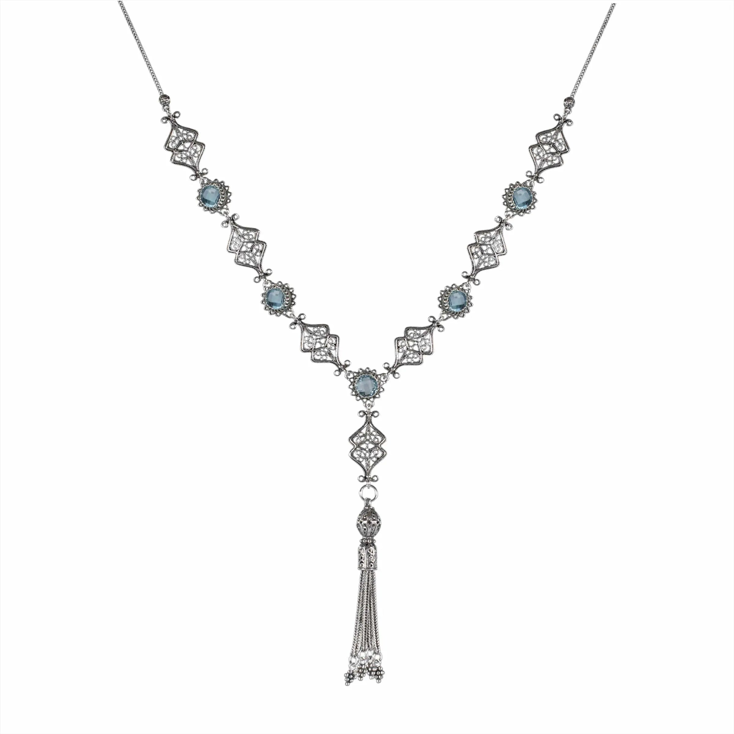 Elegant silver tassel choker necklace featuring filigree design with amethyst and blue topaz gemstones.