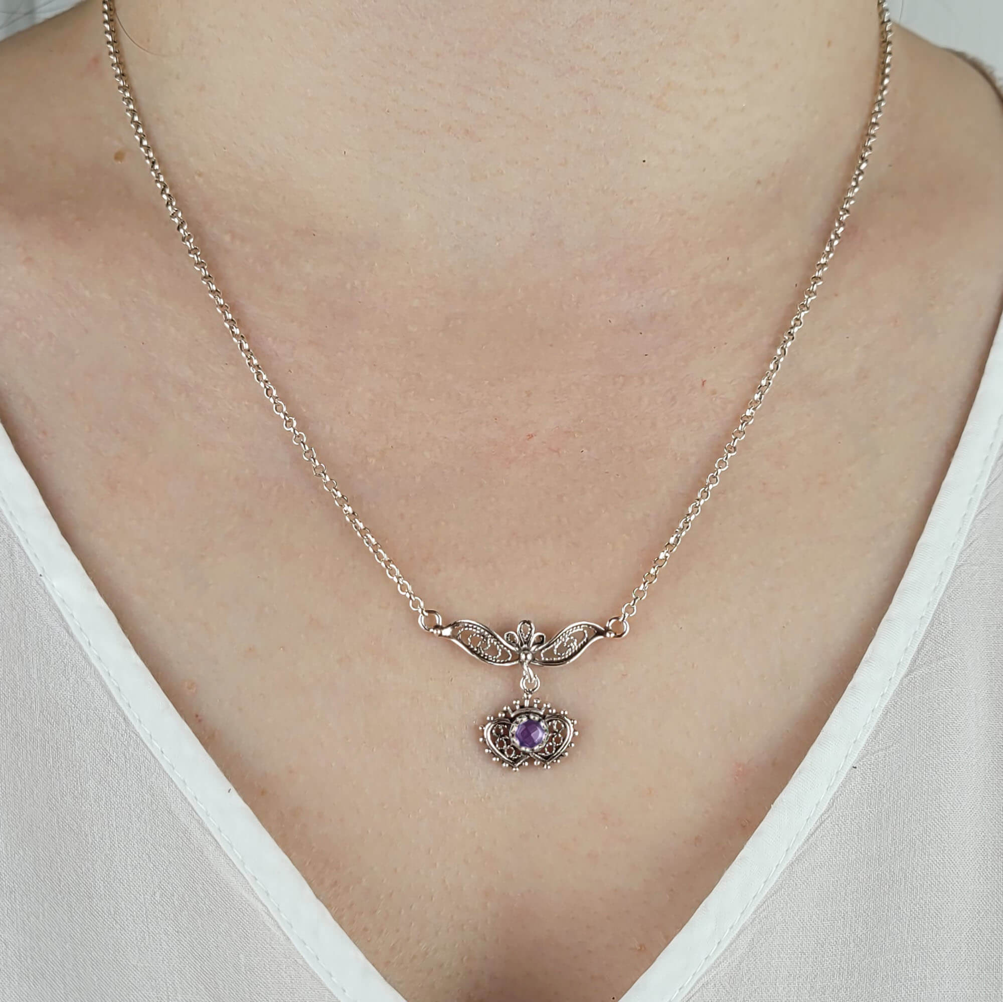 Sterling silver filigree choker necklace featuring amethyst and blue topaz gemstones in a heart to heart design.