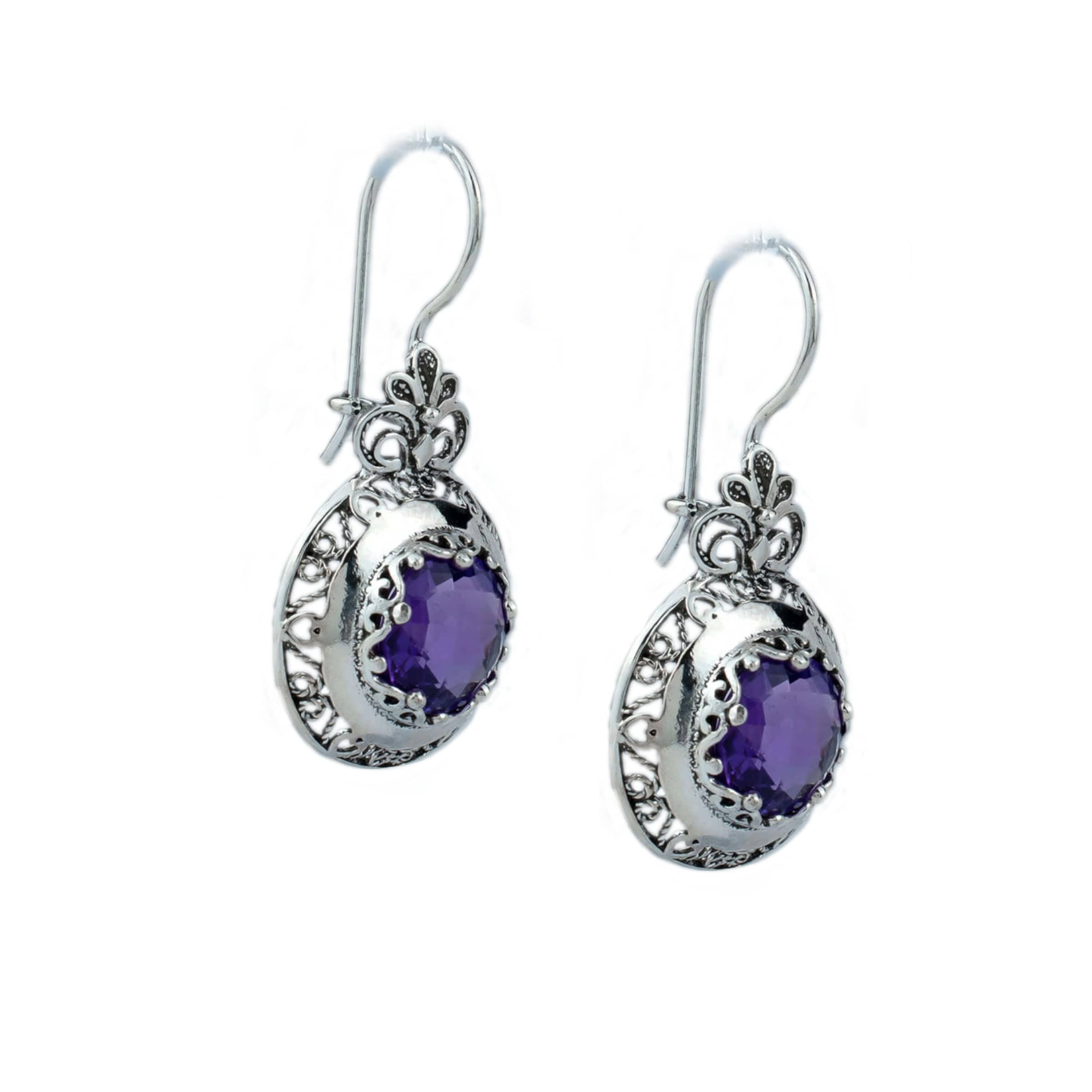 Handmade silver drop earrings featuring intricate filigree floral design and vibrant Amethyst gemstones, elegantly packaged.