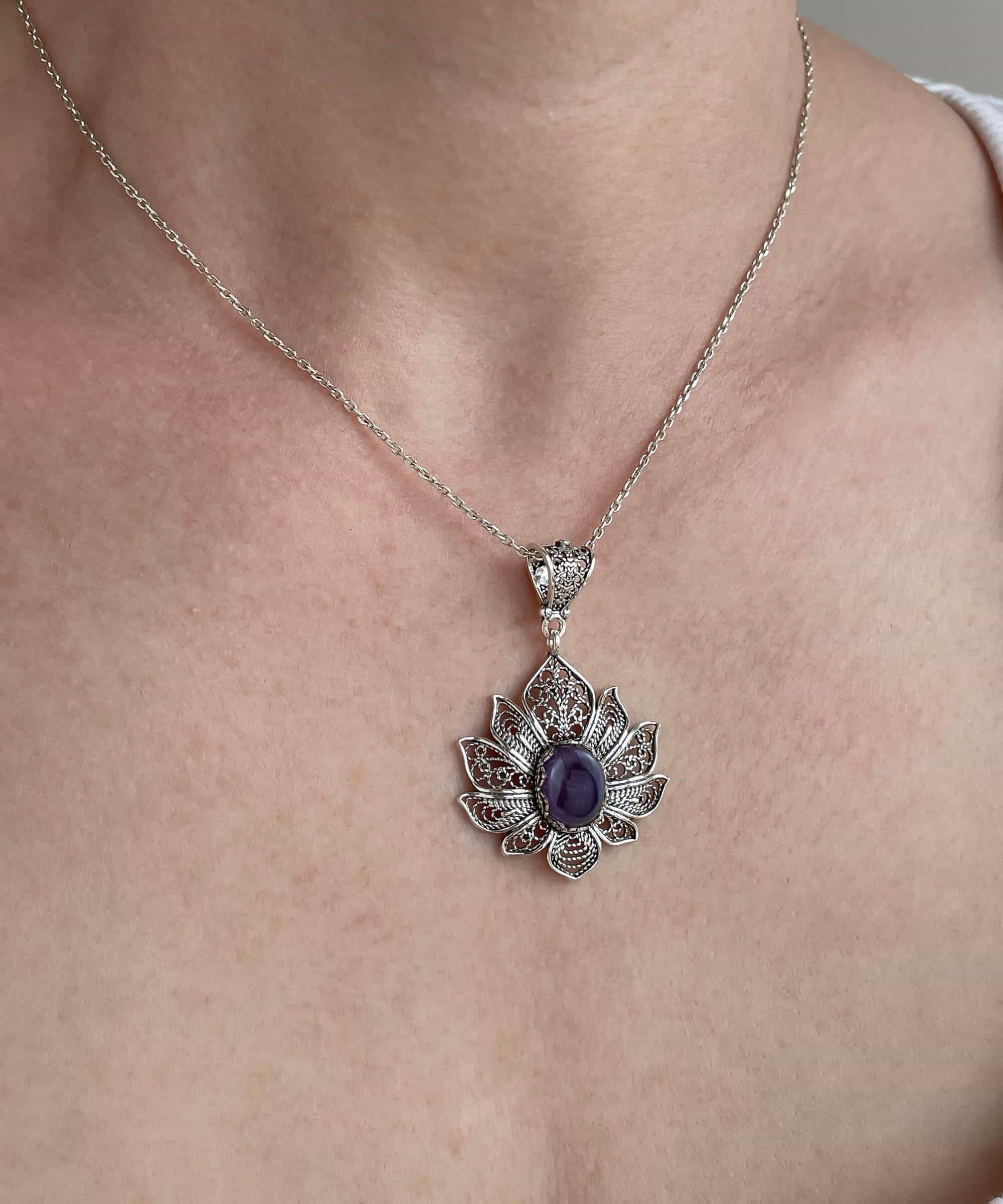 Handcrafted 925 Sterling Silver pendant featuring a filigree lotus flower design with an oval-cut Amethyst gemstone.