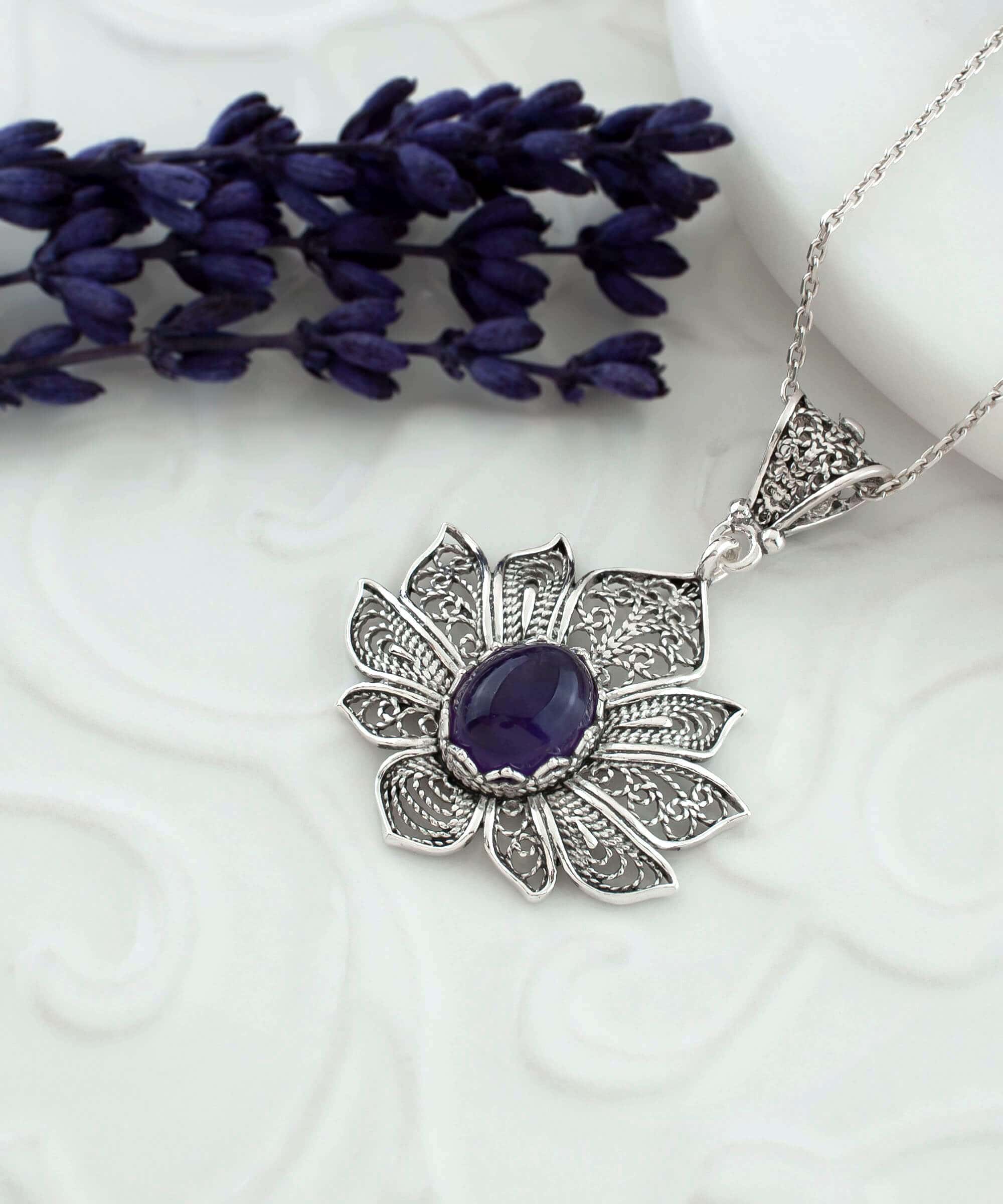 Handcrafted 925 Sterling Silver pendant featuring a filigree lotus flower design with an oval-cut Amethyst gemstone.