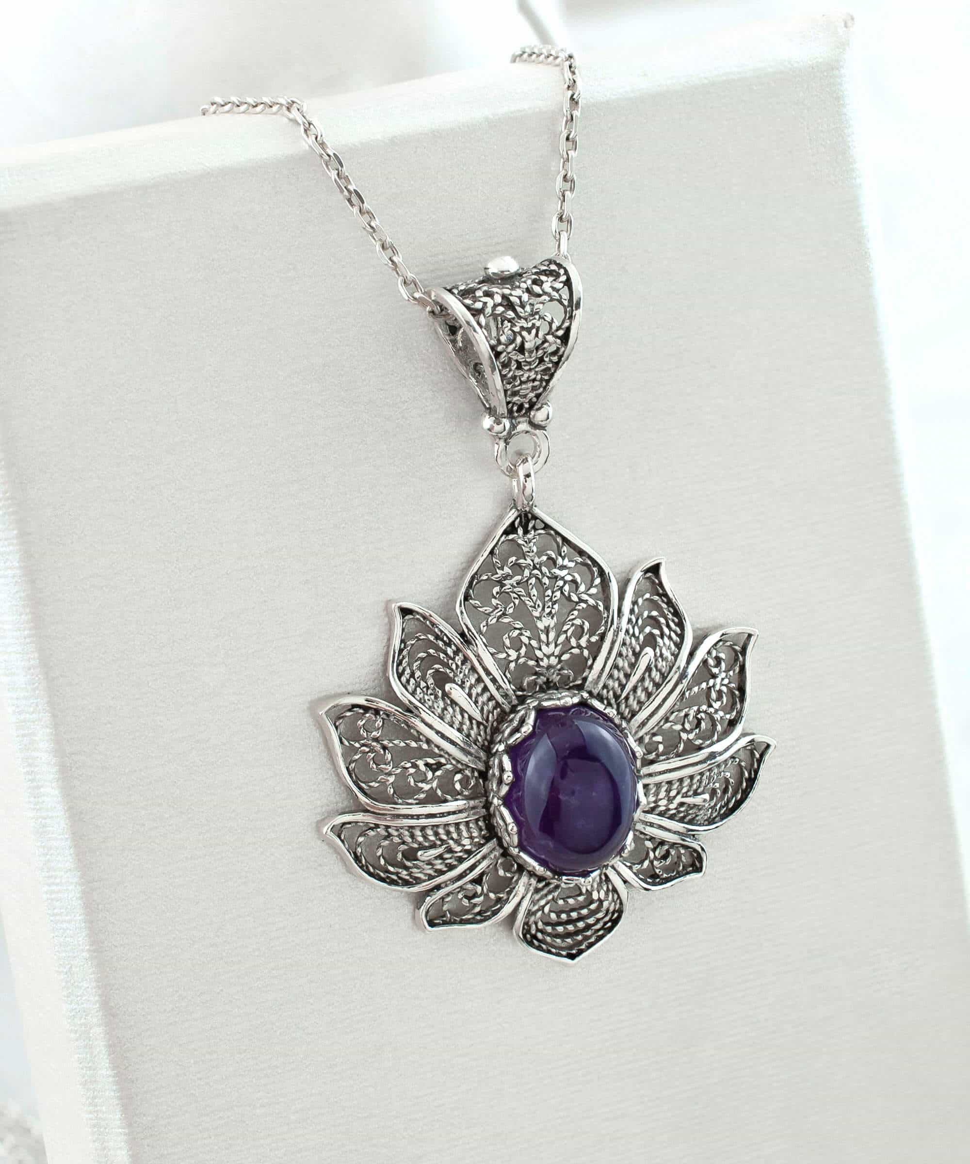 Handcrafted 925 Sterling Silver pendant featuring a filigree lotus flower design with an oval-cut Amethyst gemstone.