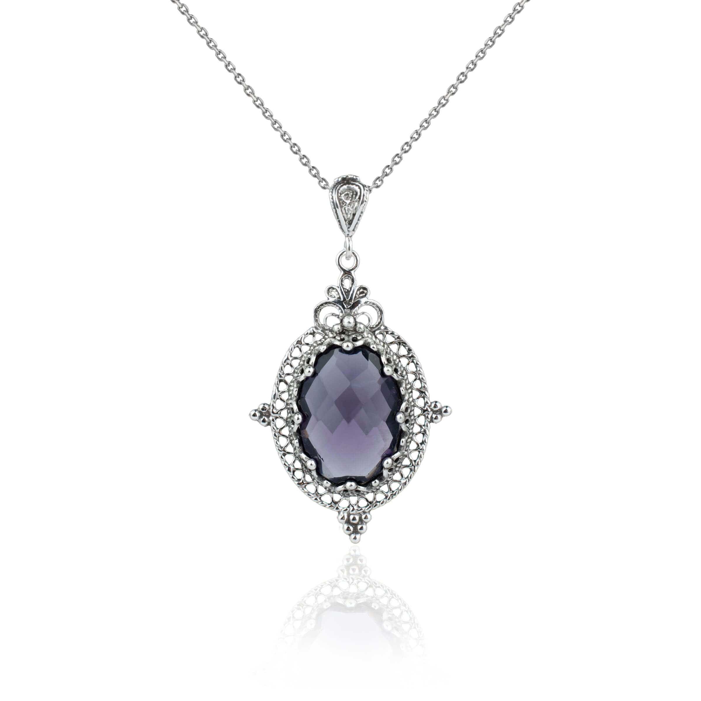 Elegant sterling silver filigree pendant necklace featuring a stunning amethyst gemstone in an oval shape, beautifully crafted for women.