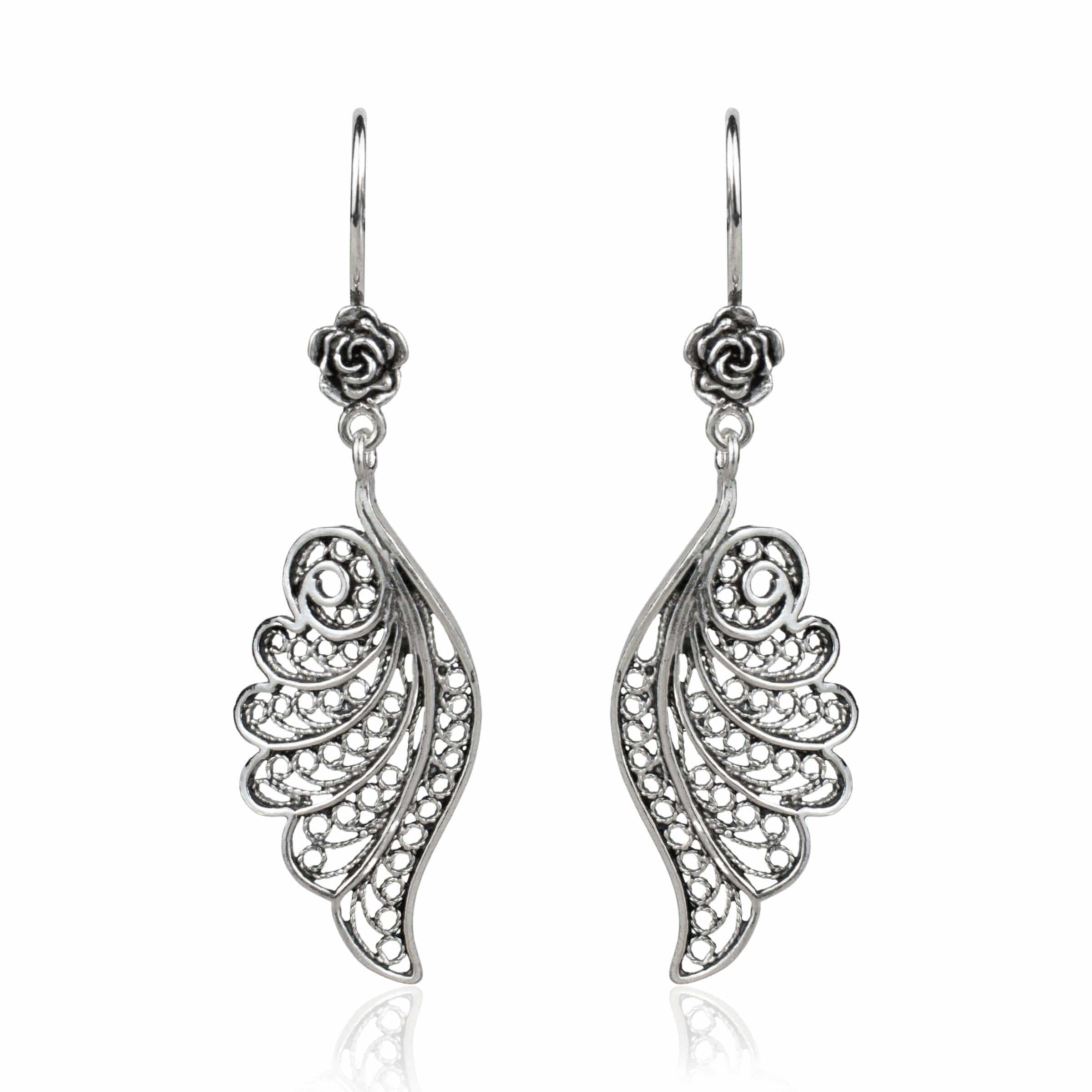 Elegant silver dangle drop earrings featuring intricate filigree angel wings design, handmade from high-quality 925 sterling silver.