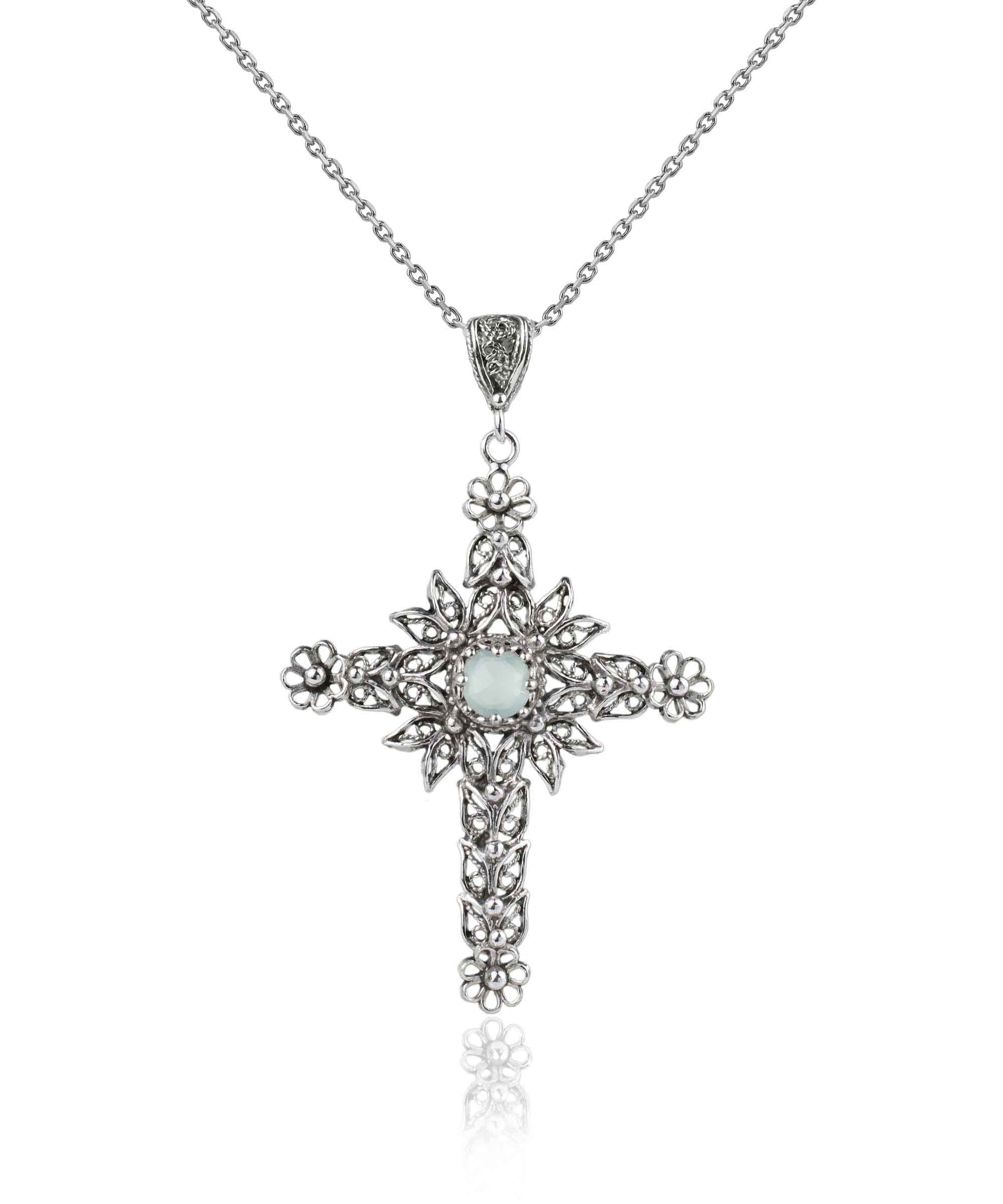 Handmade silver filigree cross pendant featuring Aqua Chalcedony gemstone, showcasing intricate details and elegant design.