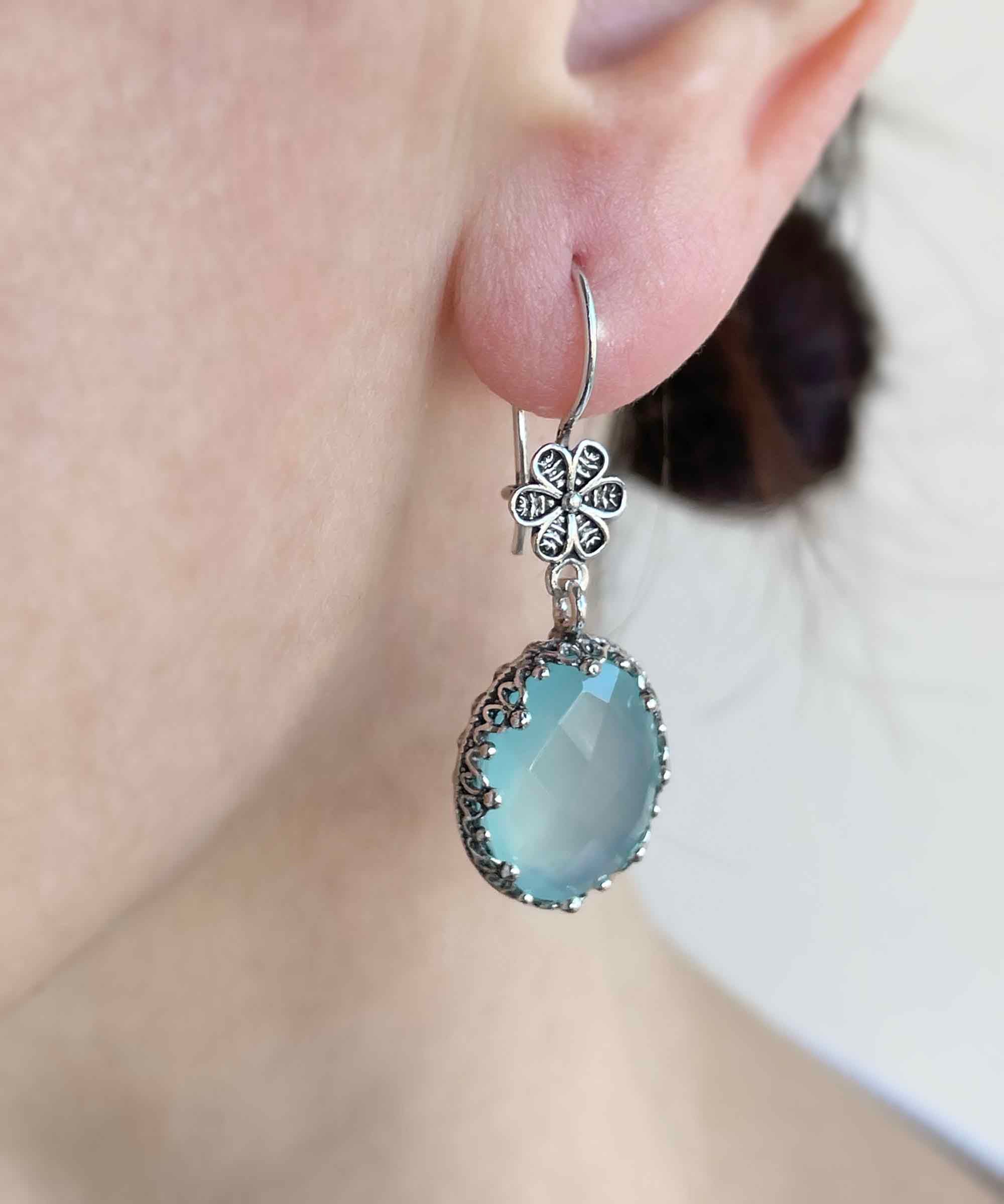 Elegant 925 sterling silver dangle earrings featuring aqua chalcedony and intricate filigree art design.