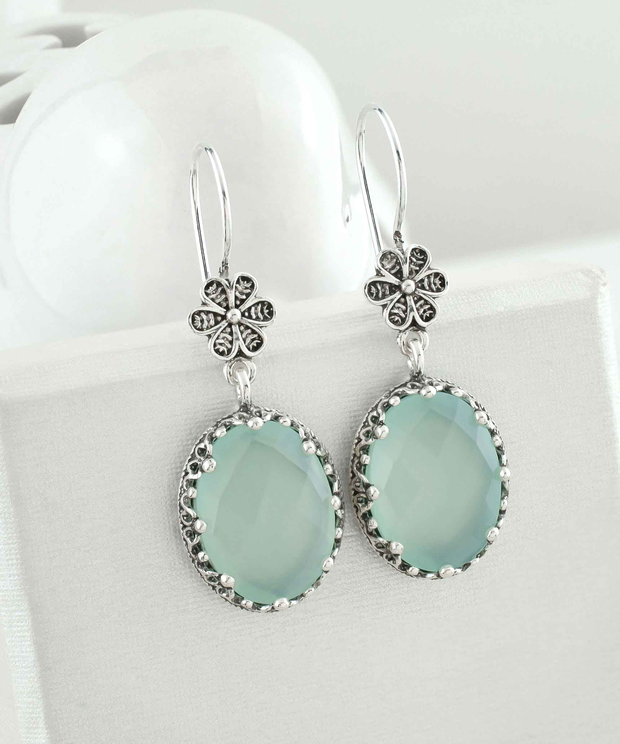 Elegant 925 sterling silver dangle earrings featuring aqua chalcedony and intricate filigree art design.