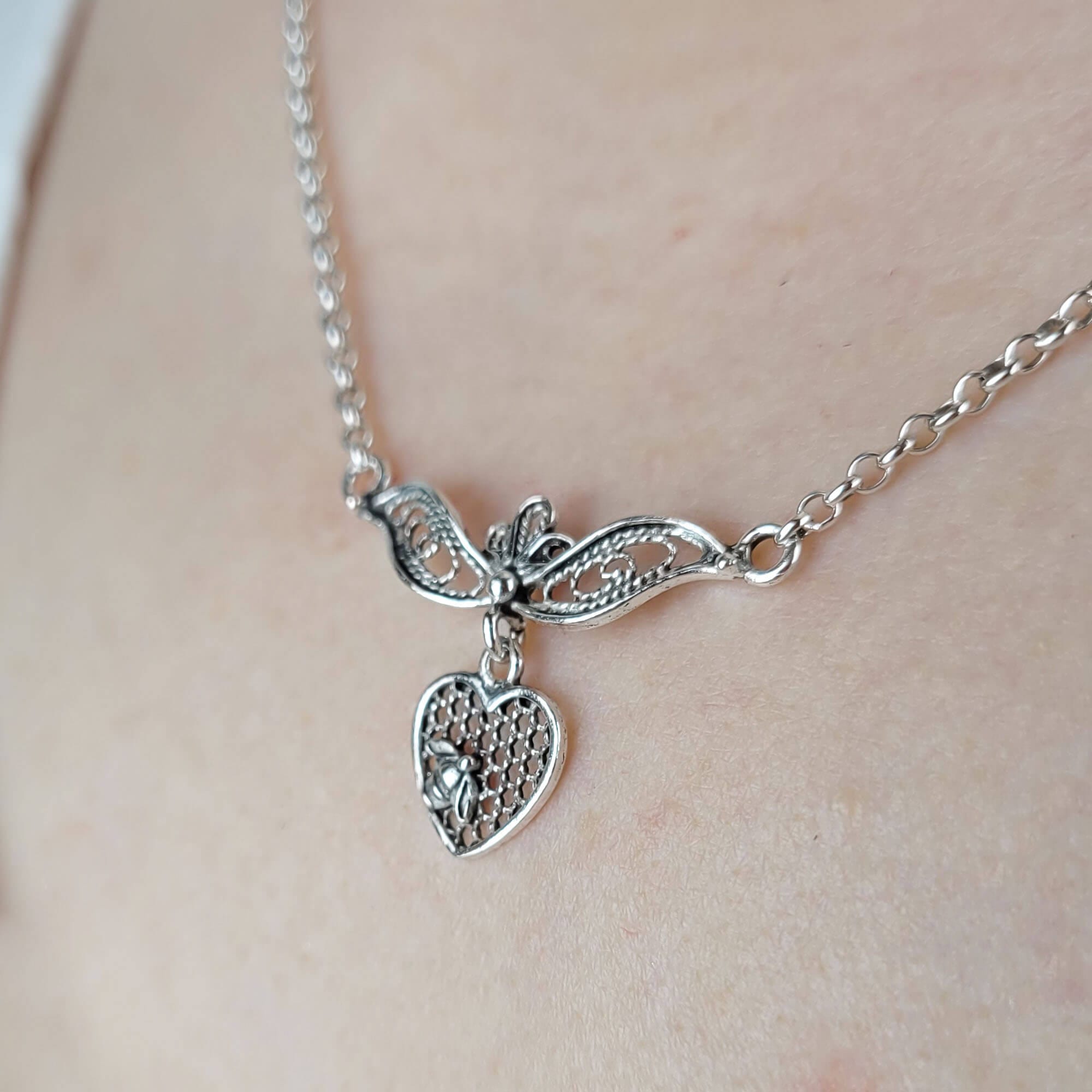 Elegant 925 sterling silver choker necklace featuring a filigree art design of a bee on a heart, showcasing intricate craftsmanship.