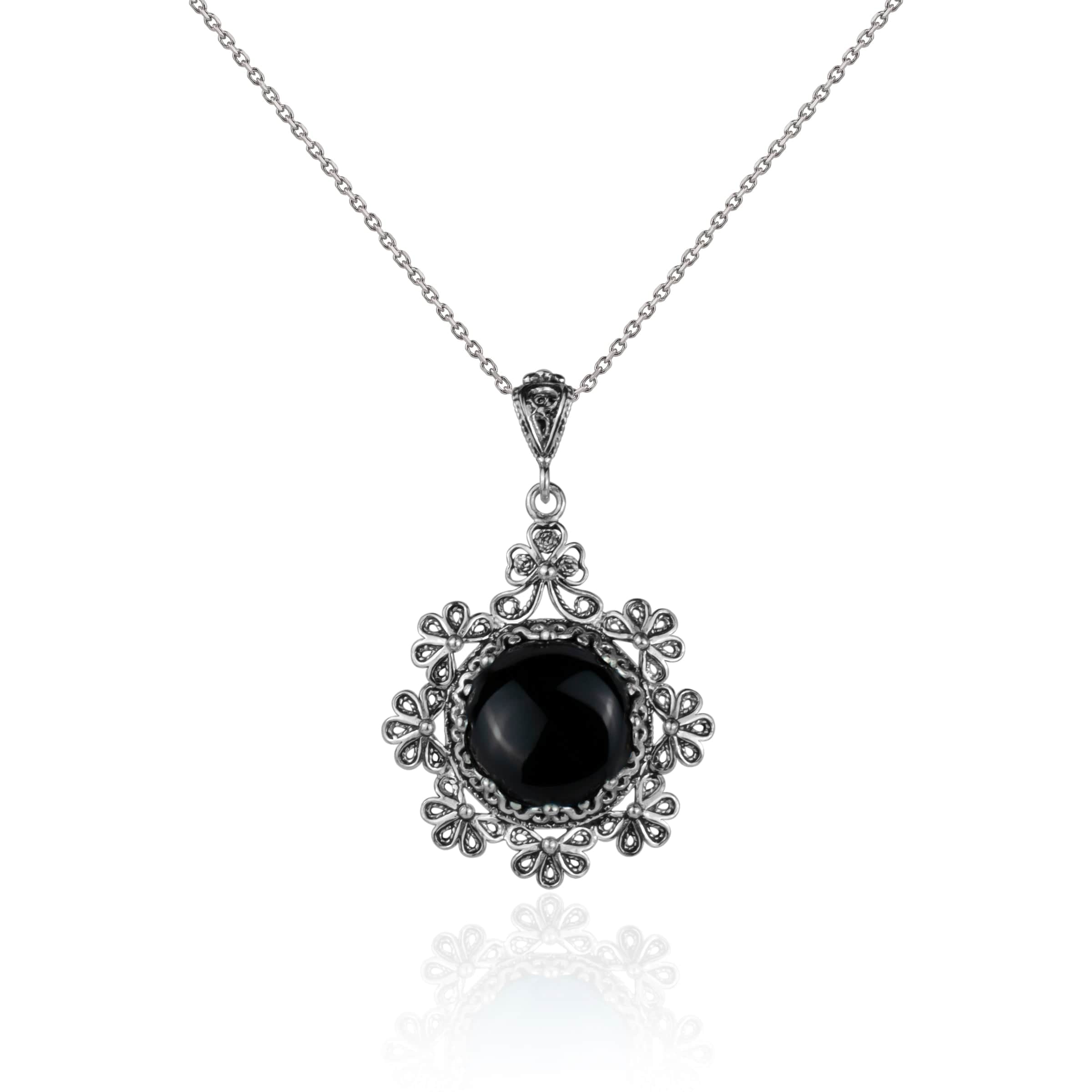 Sterling silver floral pendant featuring a black onyx gemstone, showcasing intricate filigree art design.