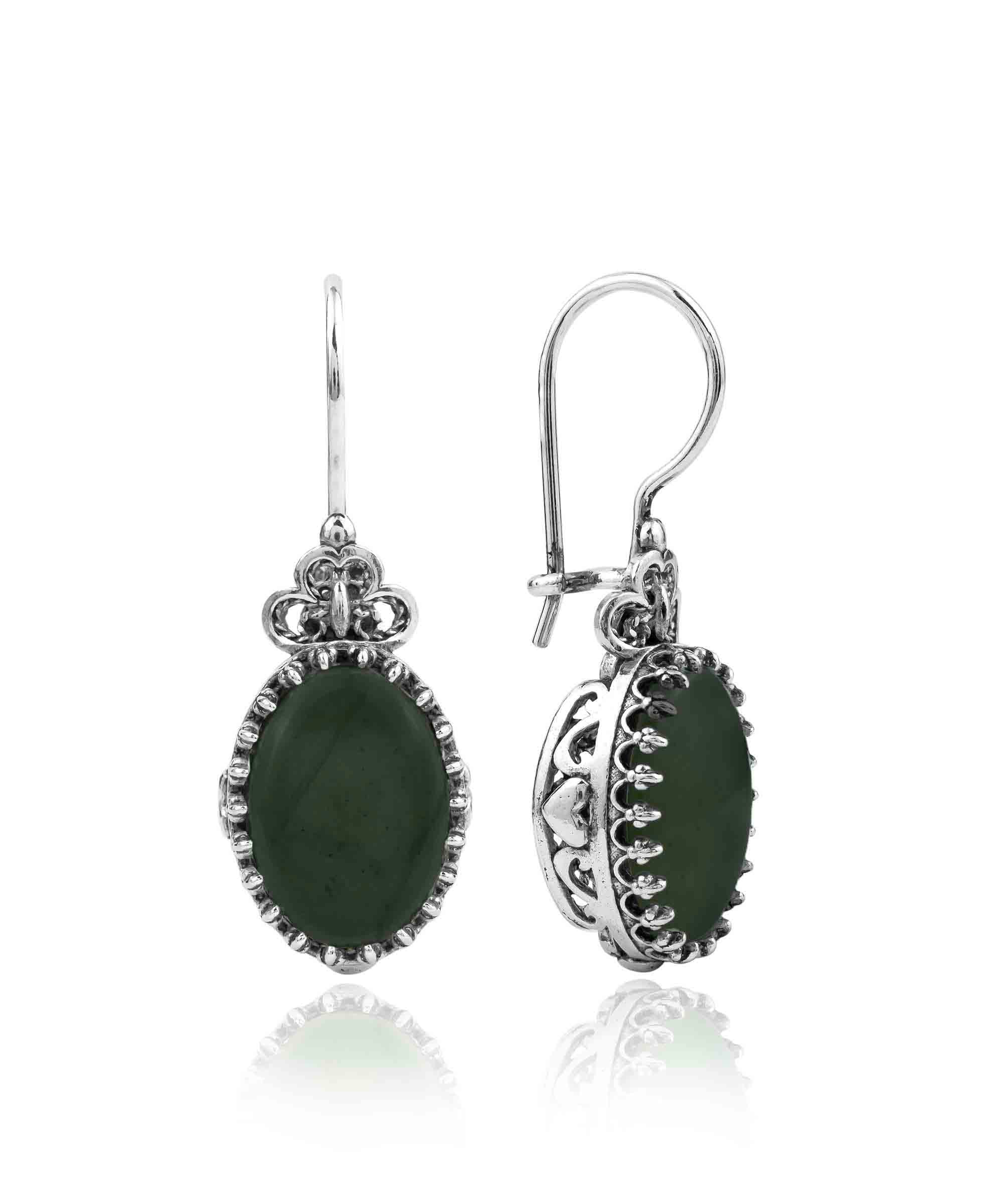 Elegant silver oval drop earrings featuring intricate filigree heart design and black onyx gemstone.