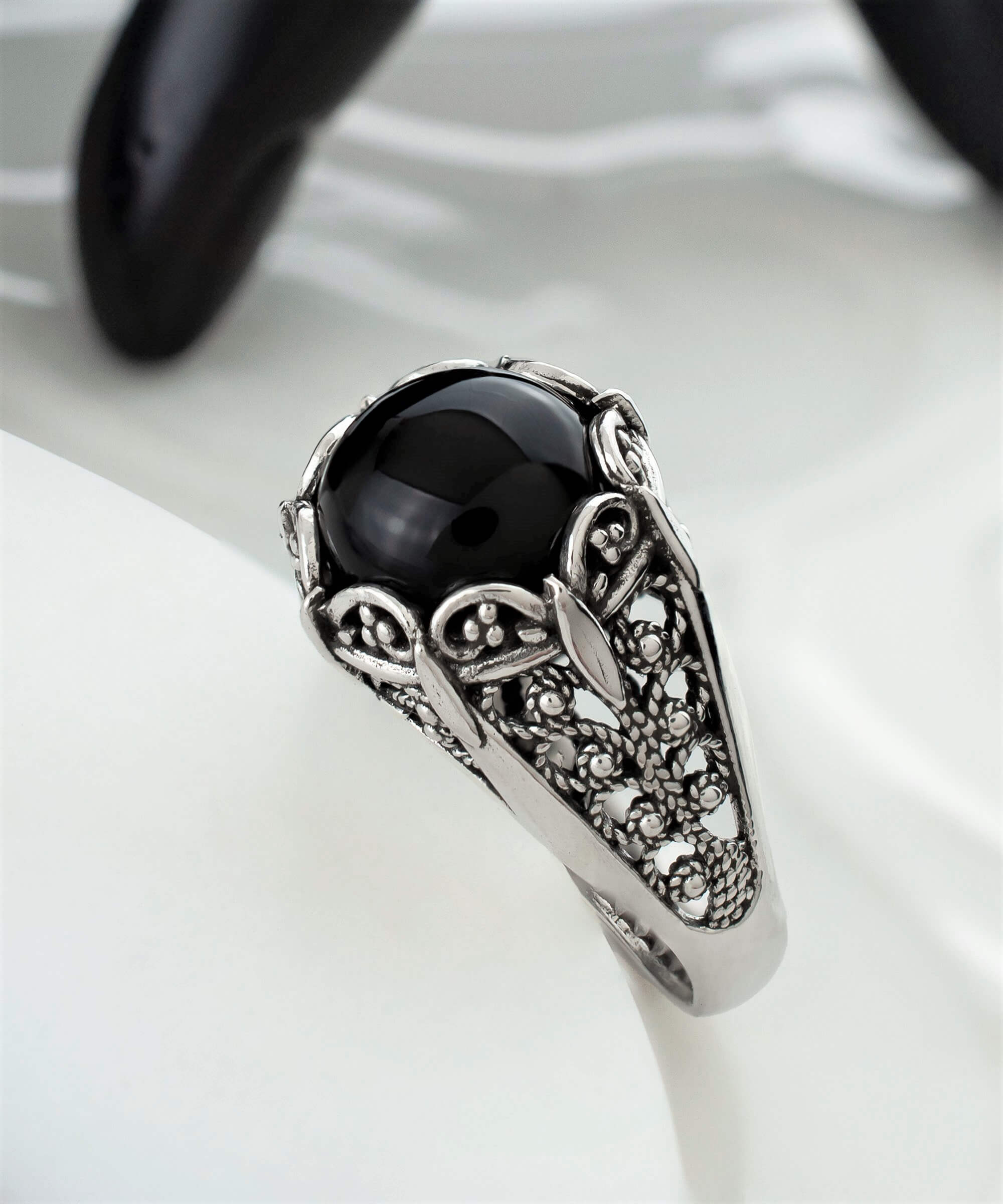 Elegant Filigree Art Black Onyx Gemstone Silver Cocktail Ring with intricate design and polished finish.