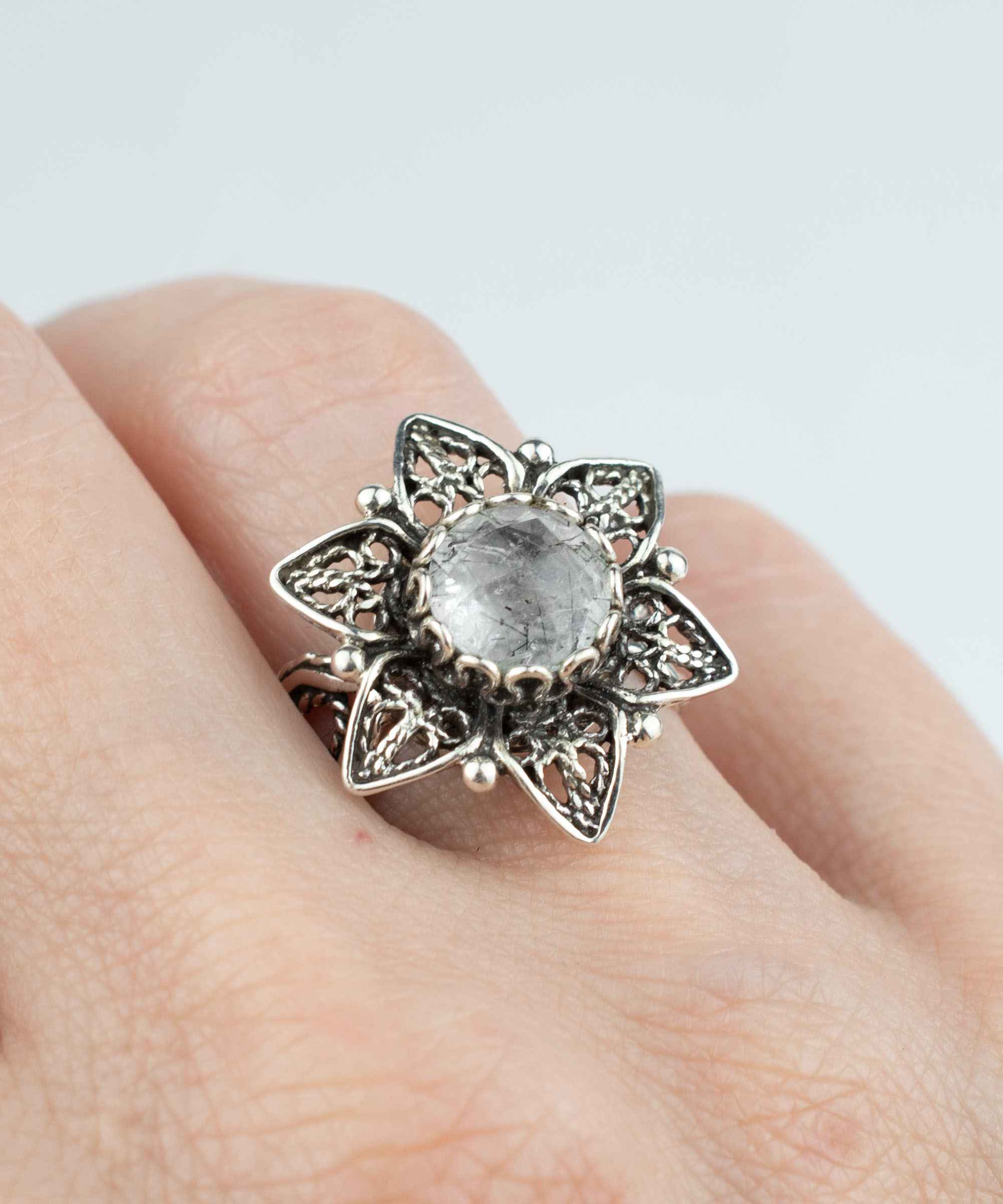 Elegant Filigree Art Black Rutile Gemstone Daisy Flower Cocktail Ring in sterling silver, showcasing intricate design and a round-cut gemstone.