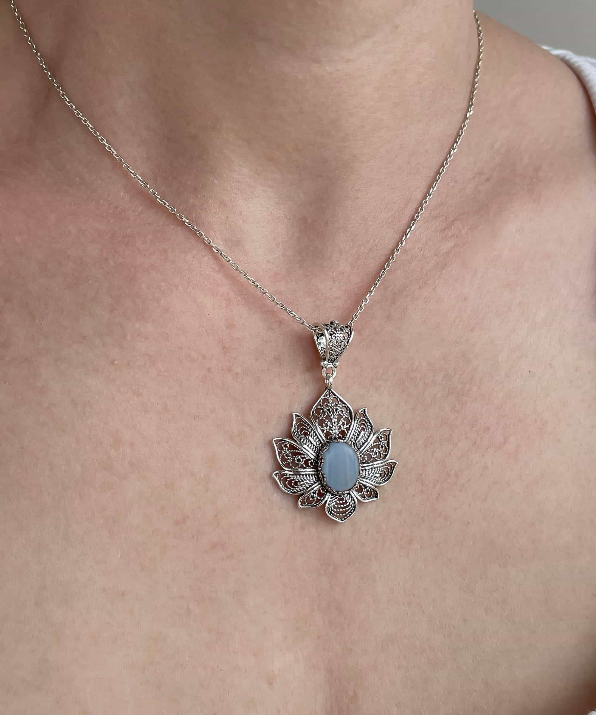 Handcrafted 925 Sterling Silver necklace featuring a blue lace agate gemstone lotus flower pendant with intricate filigree details.