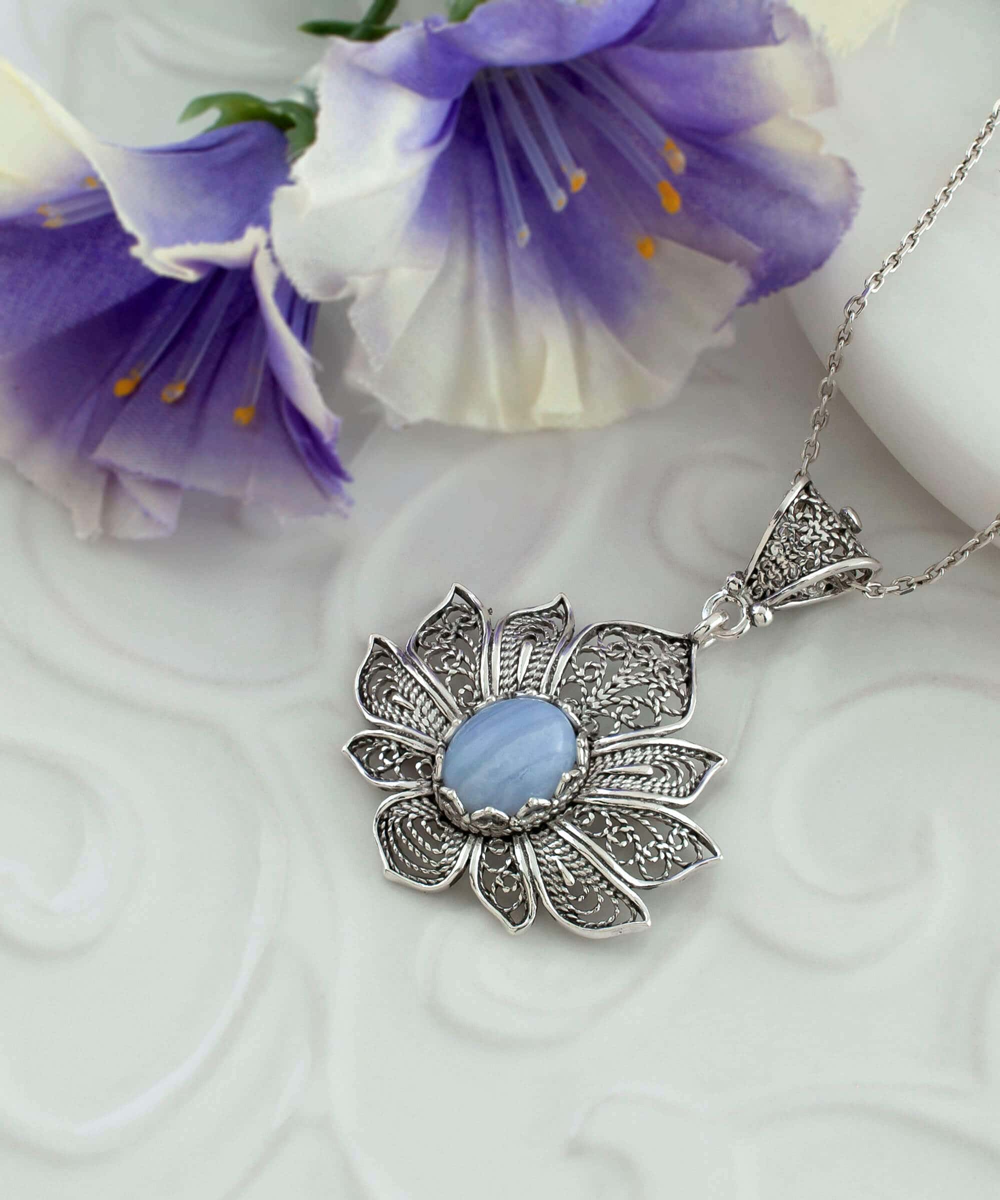 Handcrafted 925 Sterling Silver necklace featuring a blue lace agate gemstone lotus flower pendant with intricate filigree details.