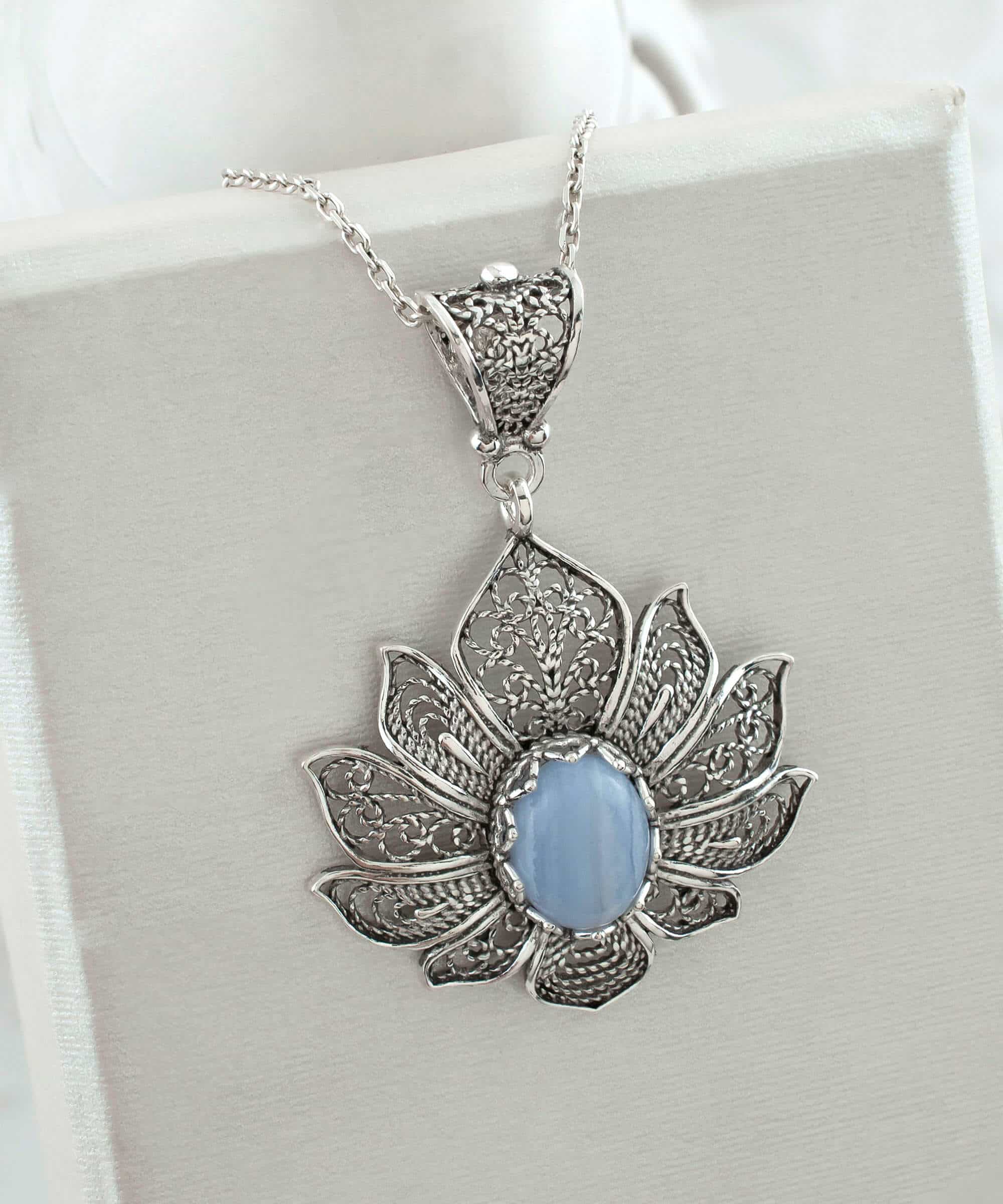 Handcrafted 925 Sterling Silver necklace featuring a blue lace agate gemstone lotus flower pendant with intricate filigree details.