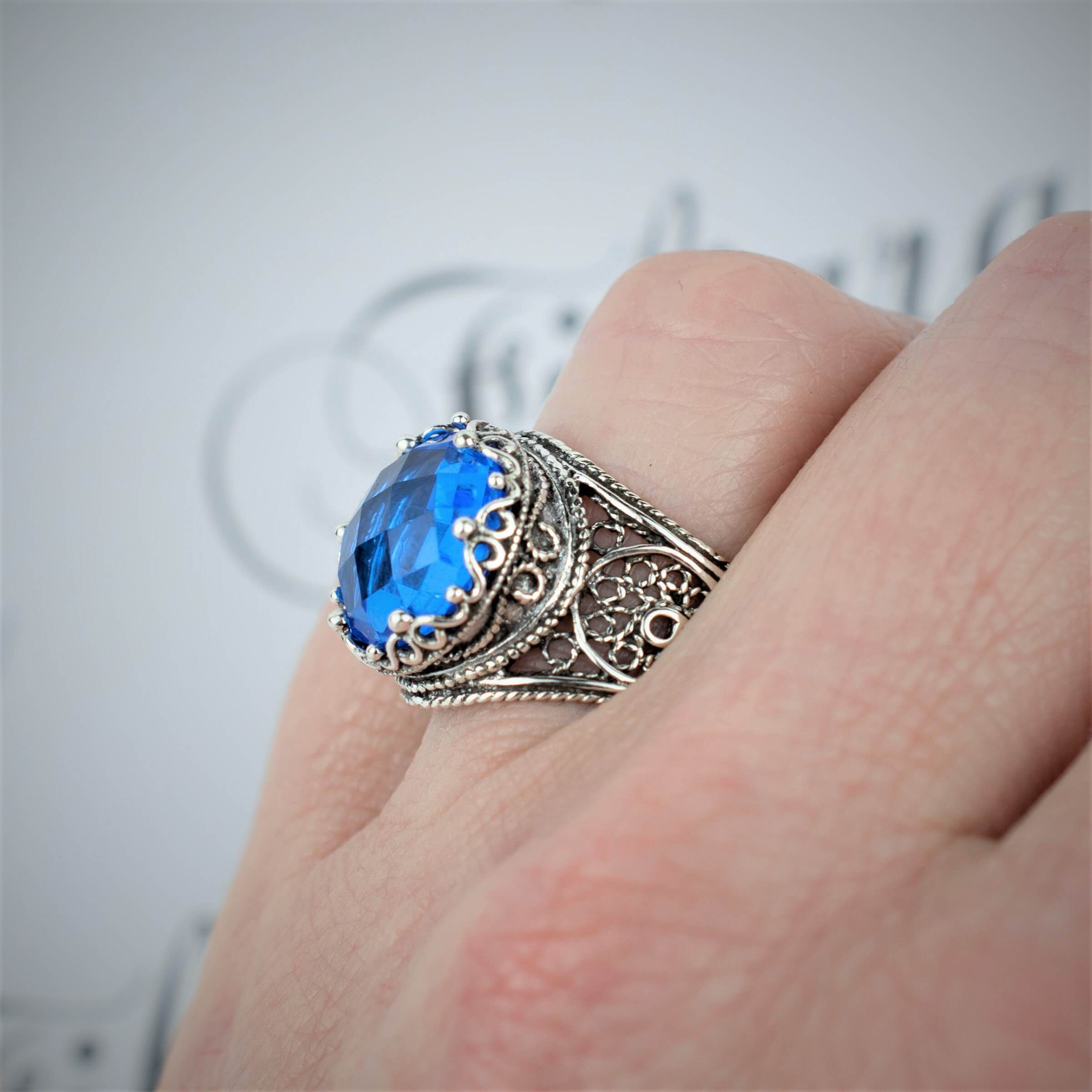 Handmade Filigree Art Blue Quartz Gemstone Crown Design ring in sterling silver, showcasing intricate craftsmanship and a stunning blue quartz centerpiece.