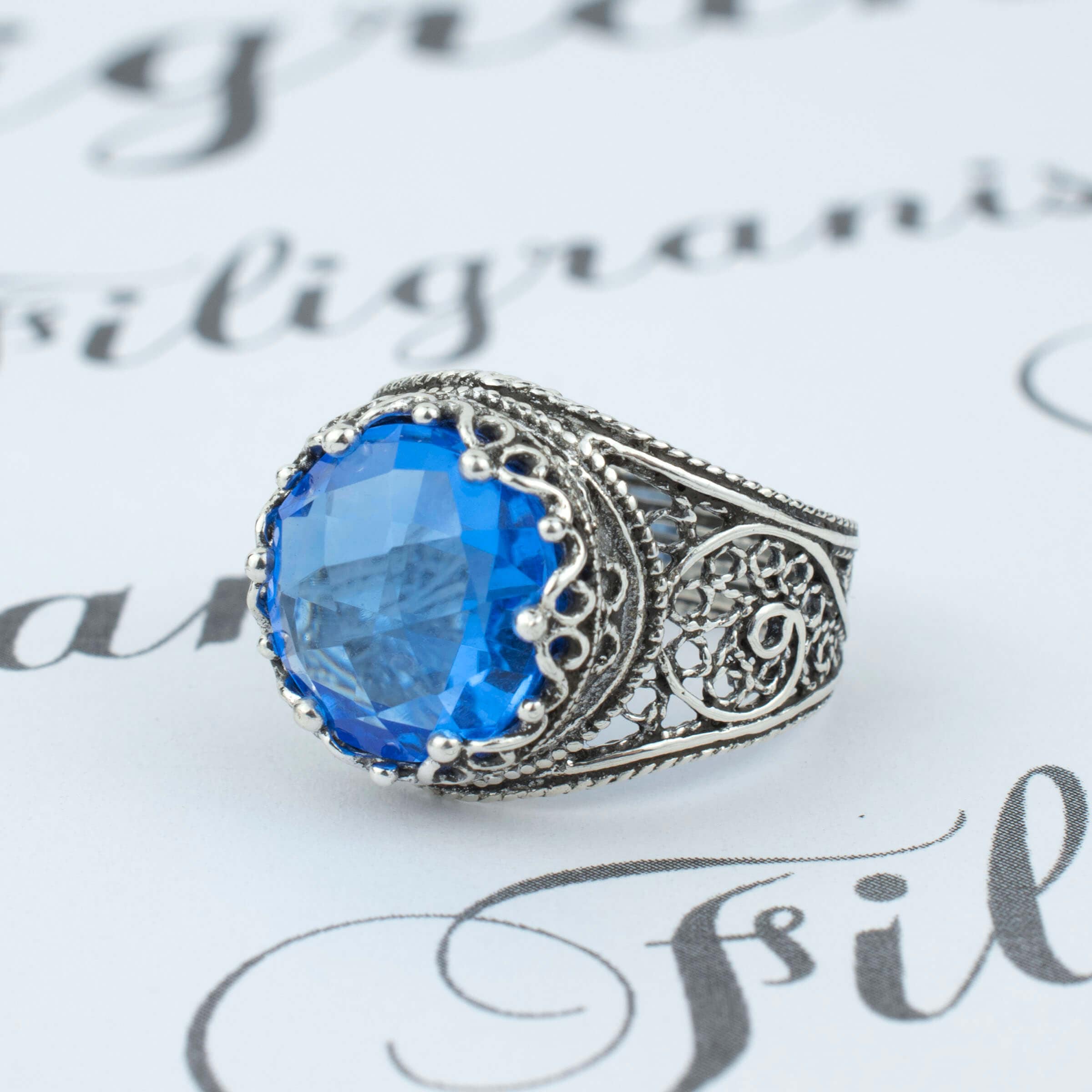 Handmade Filigree Art Blue Quartz Gemstone Crown Design ring in sterling silver, showcasing intricate craftsmanship and a stunning blue quartz centerpiece.