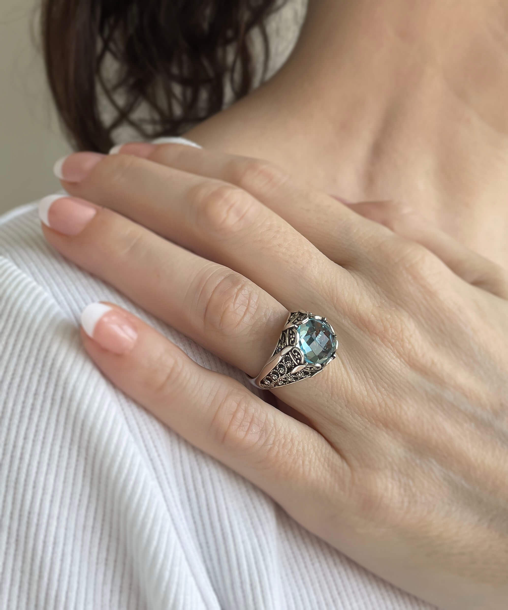 Elegant Filigree Art Blue Topaz Gemstone Silver Cocktail Ring with intricate design and polished finish.