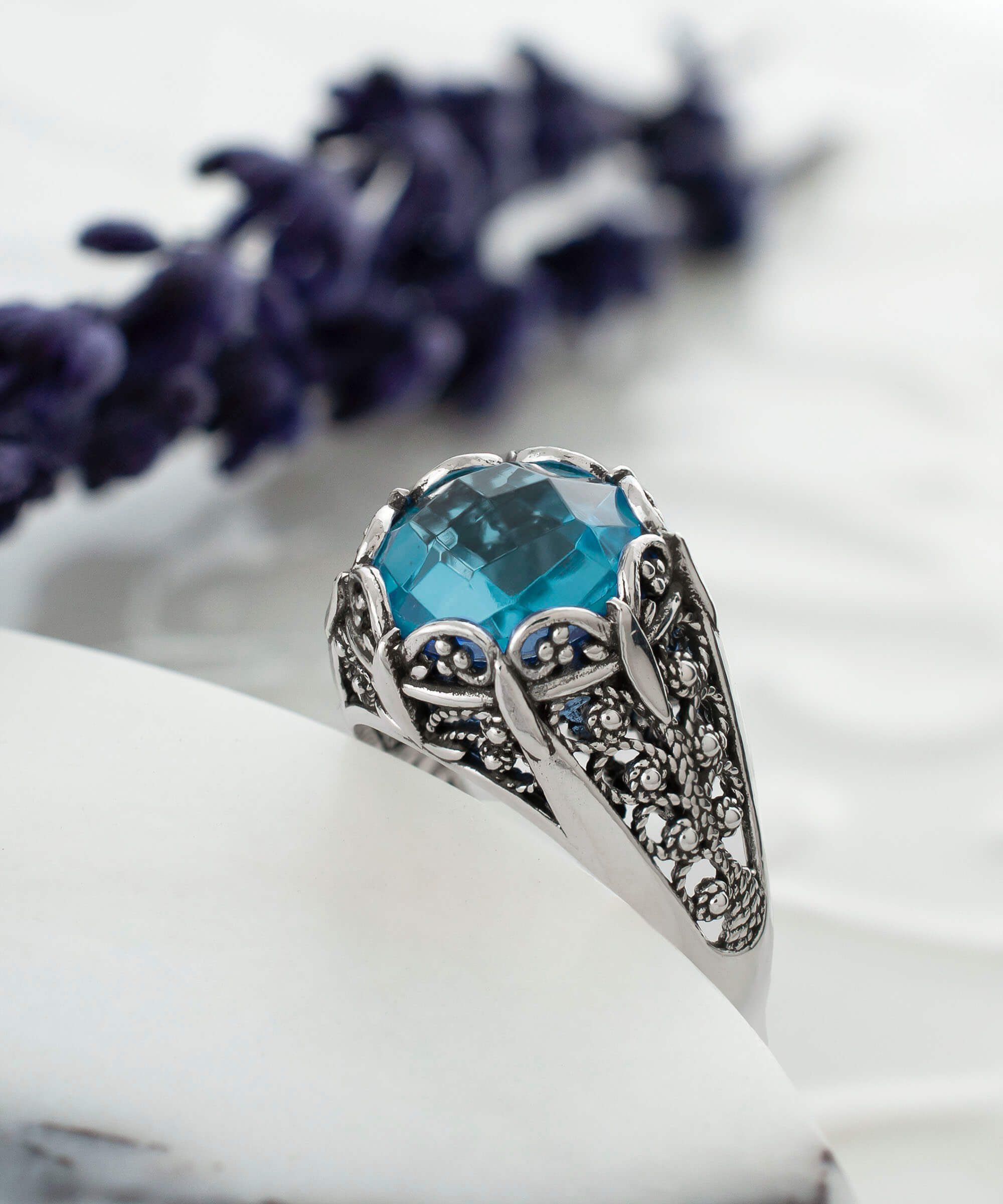 Elegant Filigree Art Blue Topaz Gemstone Silver Cocktail Ring with intricate design and polished finish.