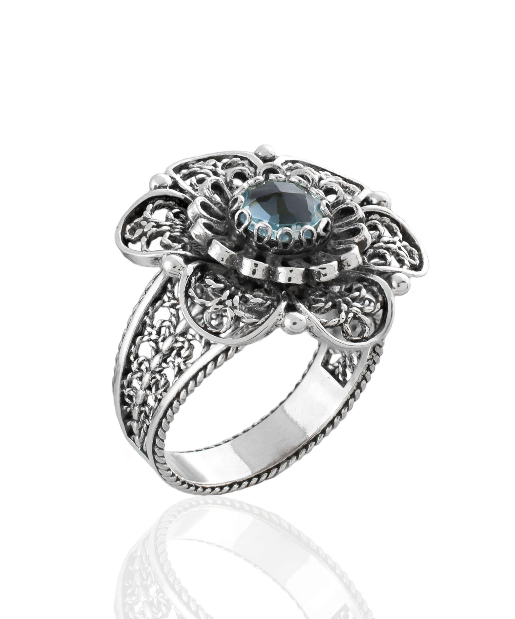 Elegant Filigree Art Blue Topaz Gemstone Women Silver Statement Ring with intricate lace flower design.