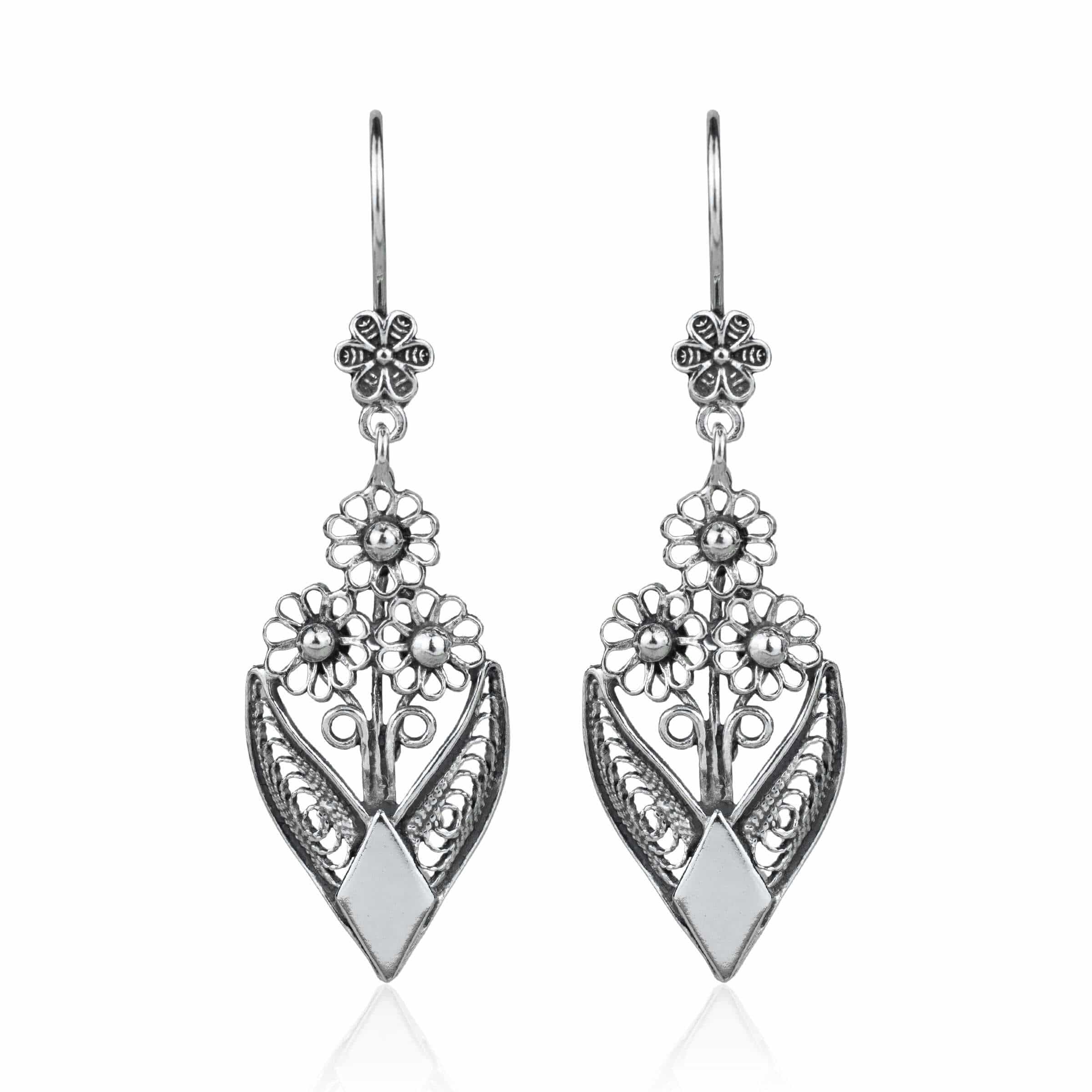 Handmade sterling silver dangle drop earrings featuring intricate filigree flower design, elegantly crafted for timeless beauty.