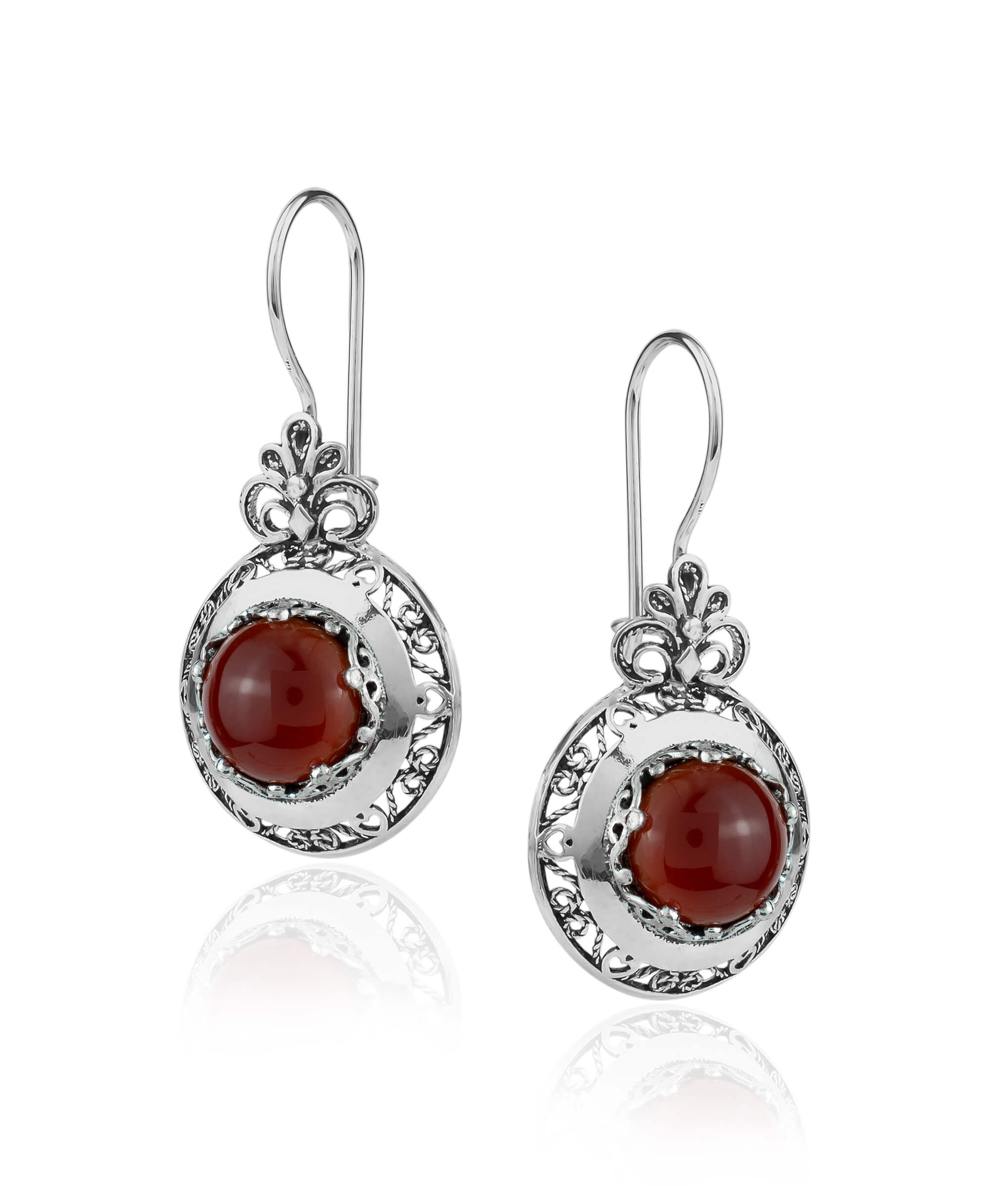 Handmade silver drop earrings featuring intricate filigree floral design and warm Carnelian gemstones, elegantly displayed in a luxurious gift box.