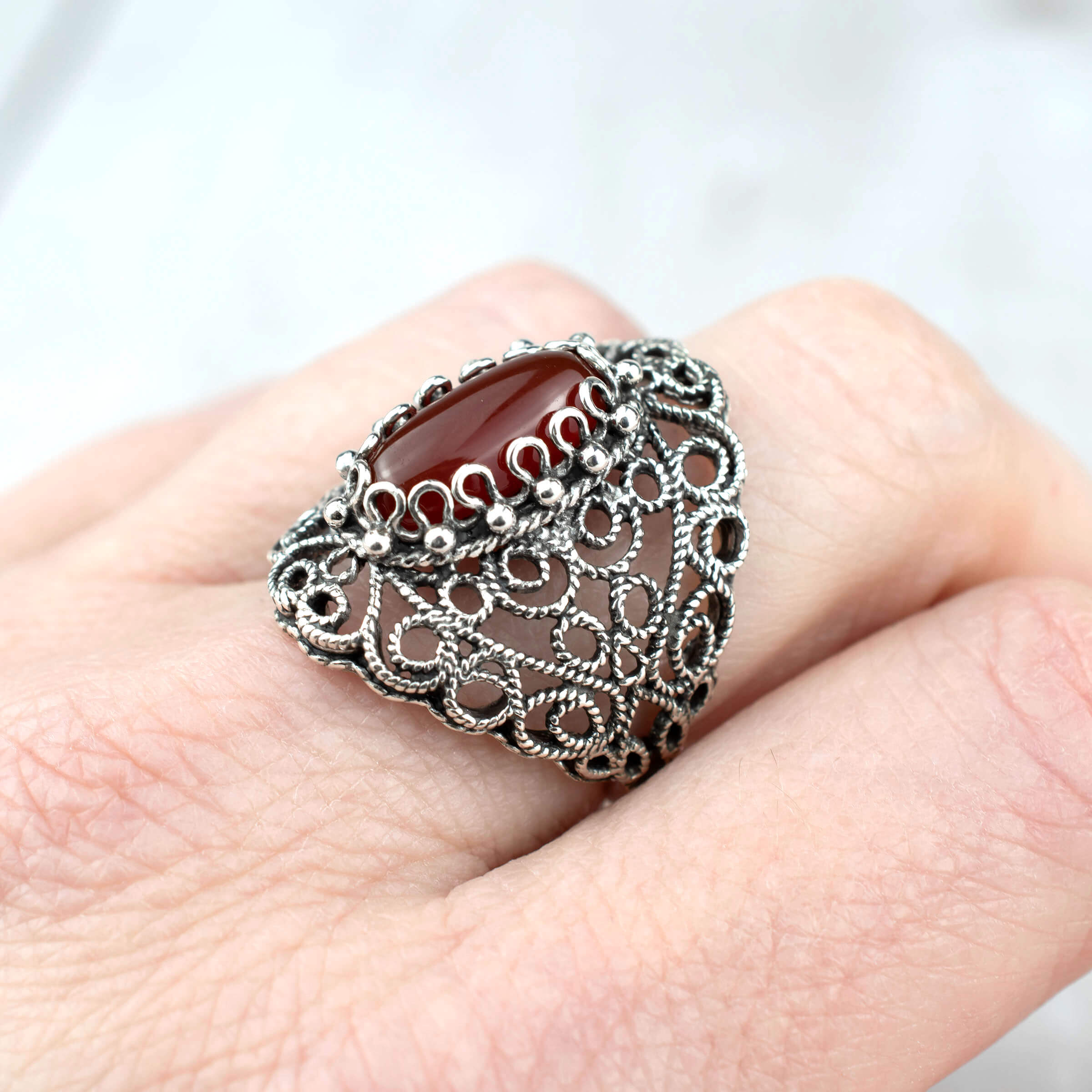 Handmade Filigree Art Carnelian Gemstone Lace Detailed Women's Silver Statement Ring featuring intricate design and vibrant carnelian stone.