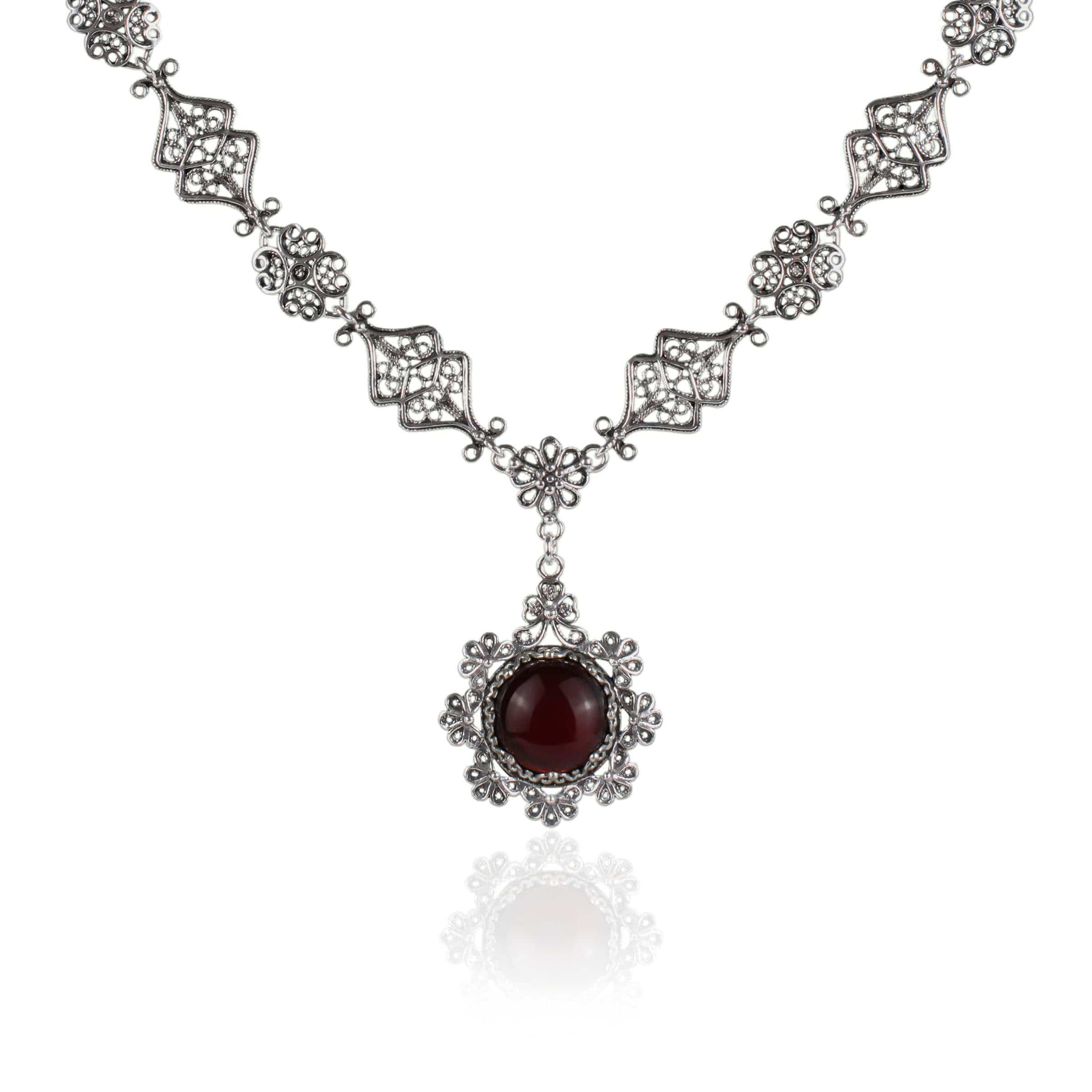 Elegant silver choker necklace featuring a round Carnelian gemstone centerpiece with intricate filigree design.