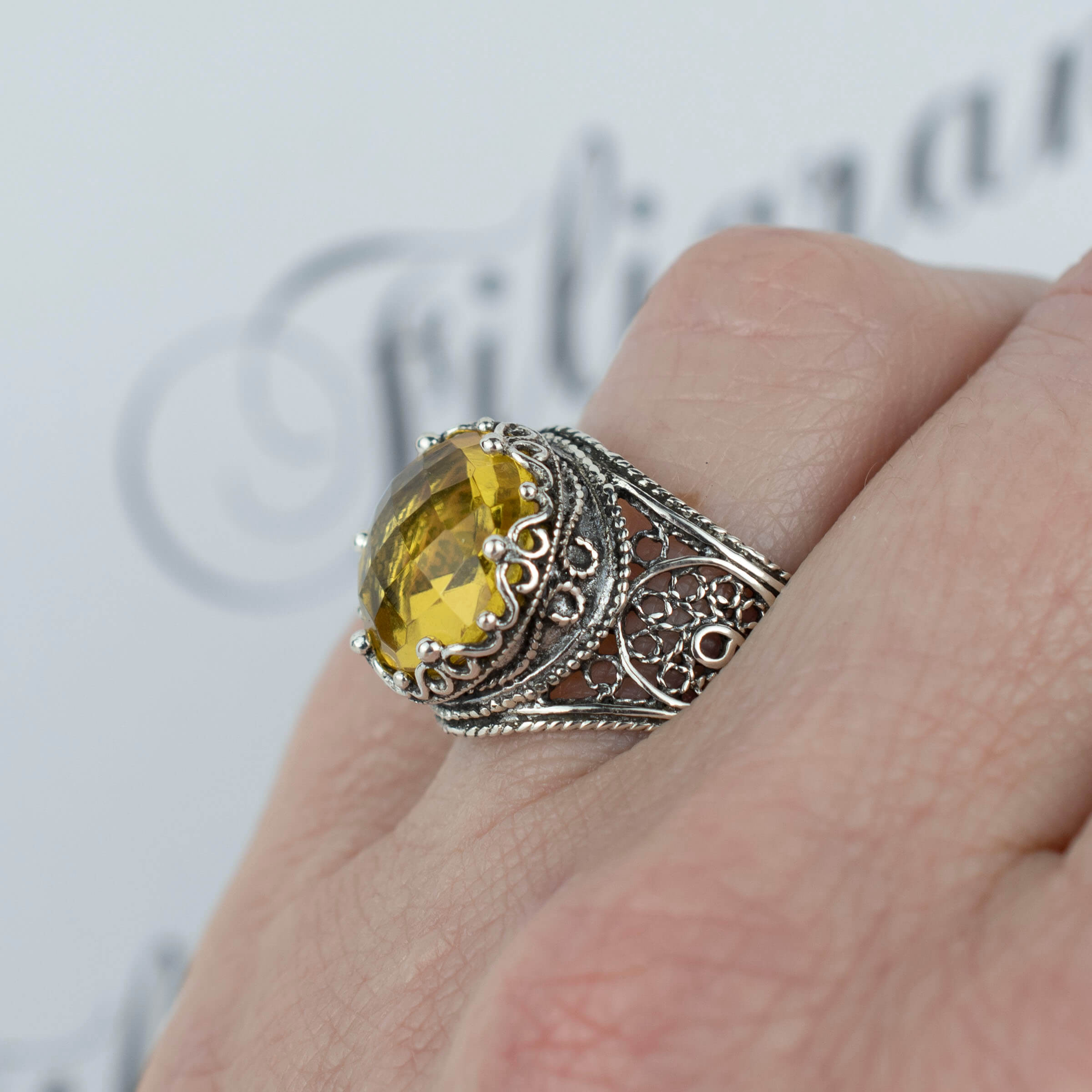 Handmade filigree art silver ring featuring a stunning 12mm citrine gemstone in a crown design, showcasing intricate craftsmanship.