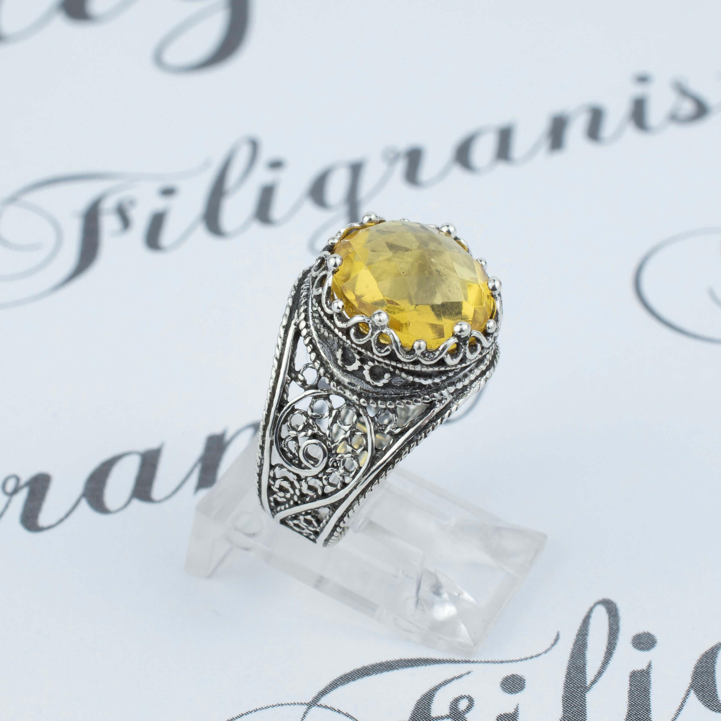 Handmade filigree art silver ring featuring a stunning 12mm citrine gemstone in a crown design, showcasing intricate craftsmanship.